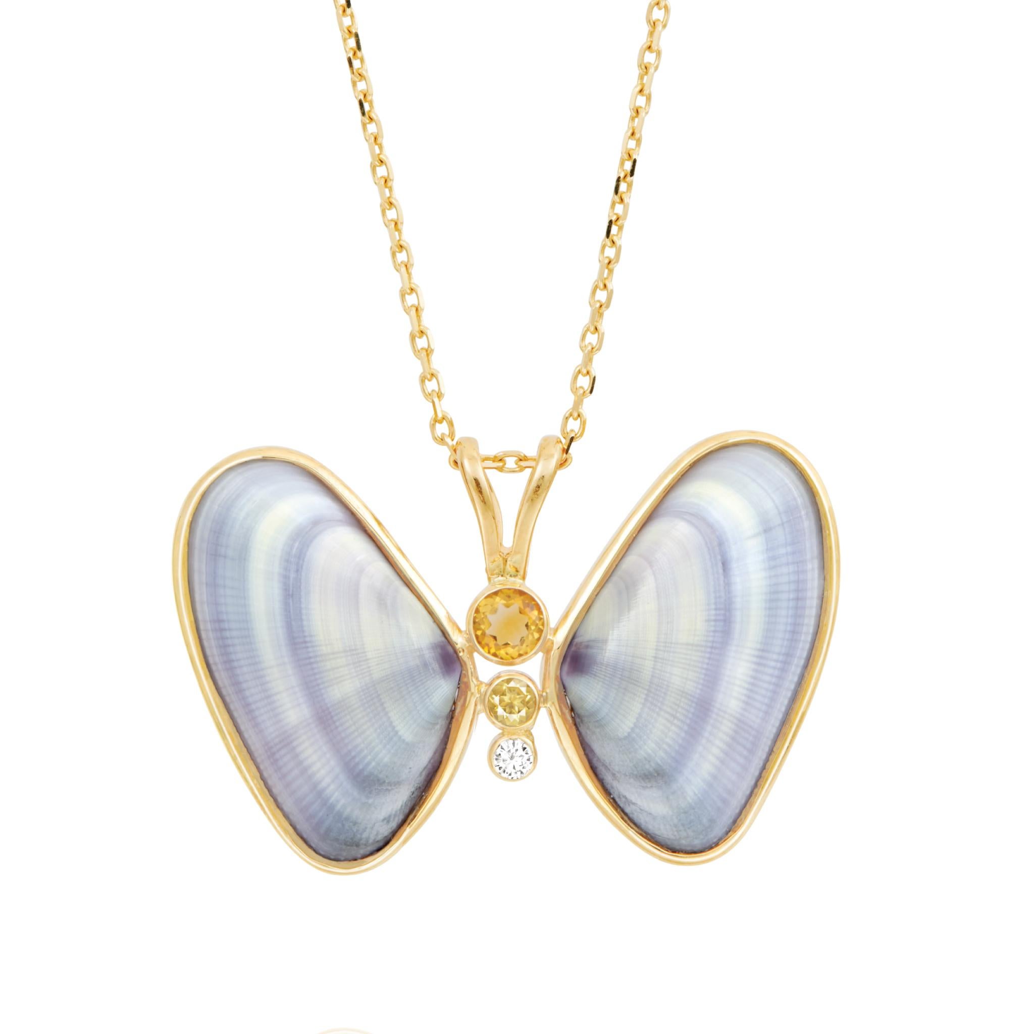 Cielo Butterfly Necklace is a luxurious fine jewelry piece made of shell with natural diamond and citrine gemstones, set in a handmade 14k gold setting. Inspired by surrealism, this whimsical piece reimagines shells found in the ocean and transforms