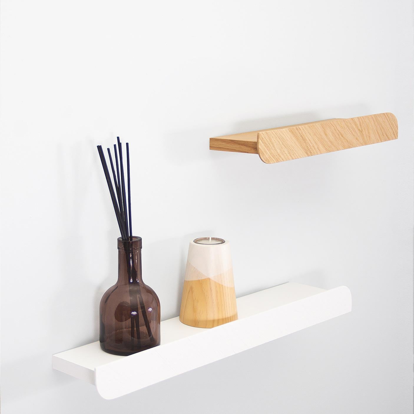 Our Cielo Shelf is a unique minimalist wall piece perfect for placing decoration with a careful design that highlights its wood vein and includes a front ledge. Its design is complemented by the collection’s iconic leaf shape that represents