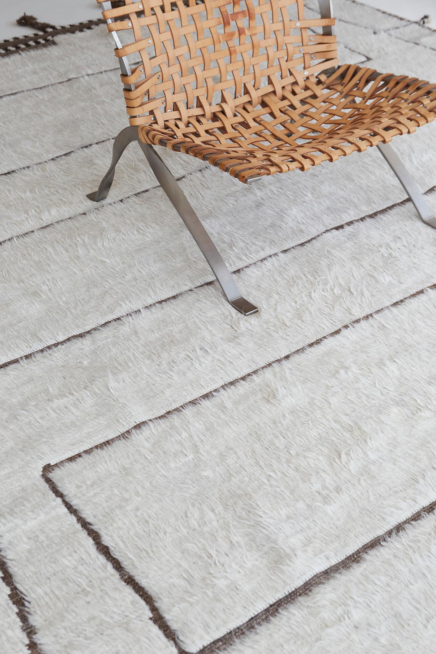The signature collection of California. Handwoven luxurious wool rug, made of timeless design elements and neutral earth tones. Haute Bohemian collection: designed in Los Angeles named for the winds knitting together seasons, trees, dwellers of