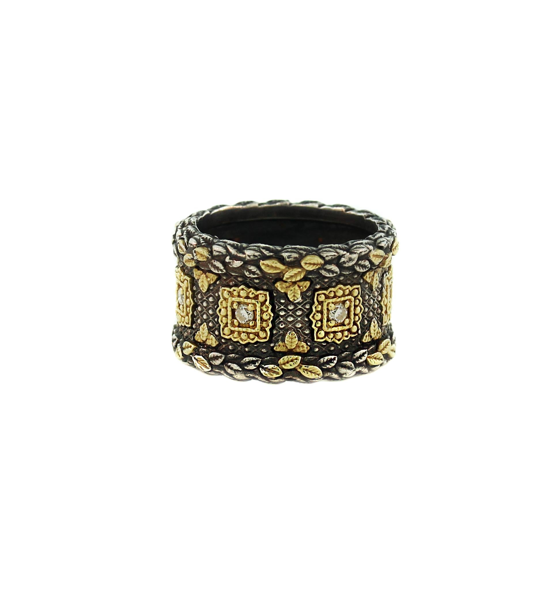Stambolian Aged Sterling Silver 18K Gold Diamond Wide Cigar Band Ring

0.30 carat diamonds total weight

Ring is done in darkened Aged Silver with touches of solid 18K Gold all throughout

Band width is 0.6 inch (15.25mm)

Available in sizes 4-12.