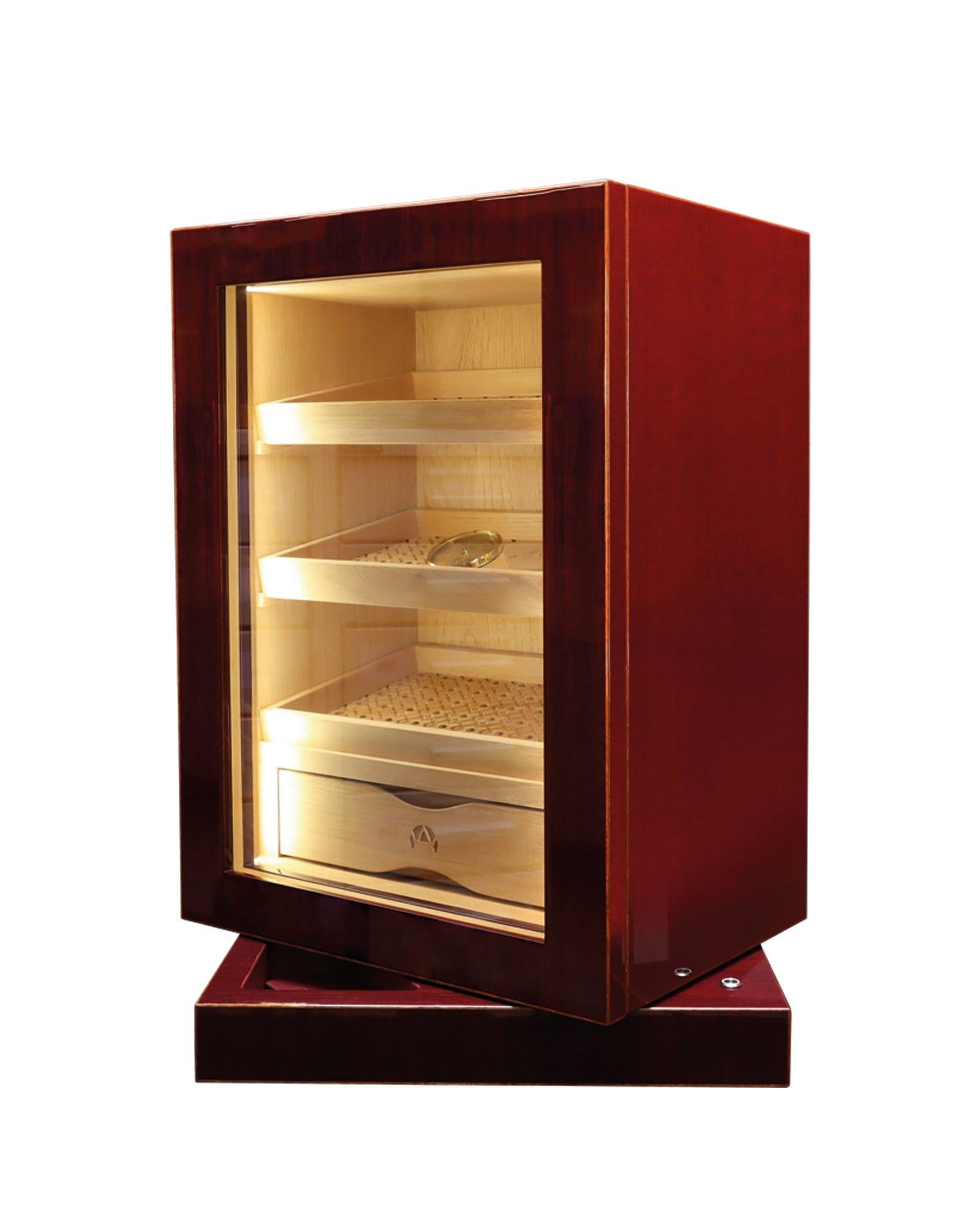 Cave à cigares de bureau en chêne rouge brillant. Ouverture par carte sans clé avec technologie RFID. A l'intérieur, 3 plateaux amovibles et un tiroir intégré en cèdre de première qualité.

Les unités d'humidification et l'hygromètre incorporés sont