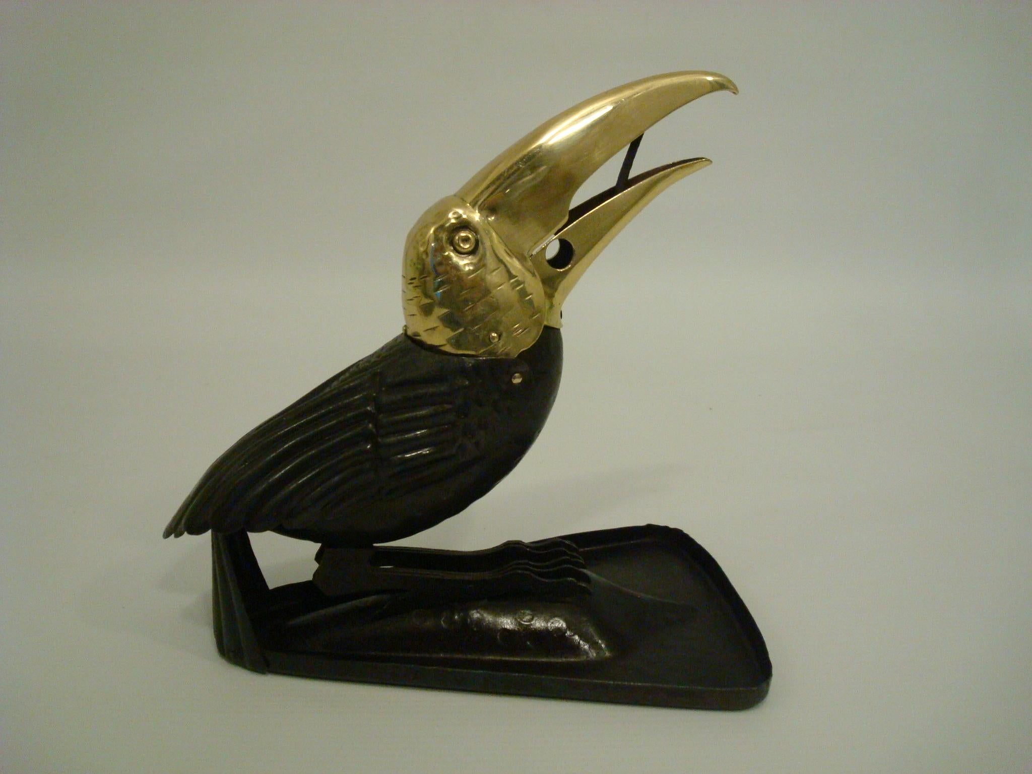 An A von Zschock brass and enameled and painted metal toucan form design table top cigar cutter, Berlin, early 20th century.
Marks: A.v. Zschock, Gladenbeck
Cigar cutter in a shape of a Toucan circa 1900-1910 Strasbourg by Adolf von Zschock.

