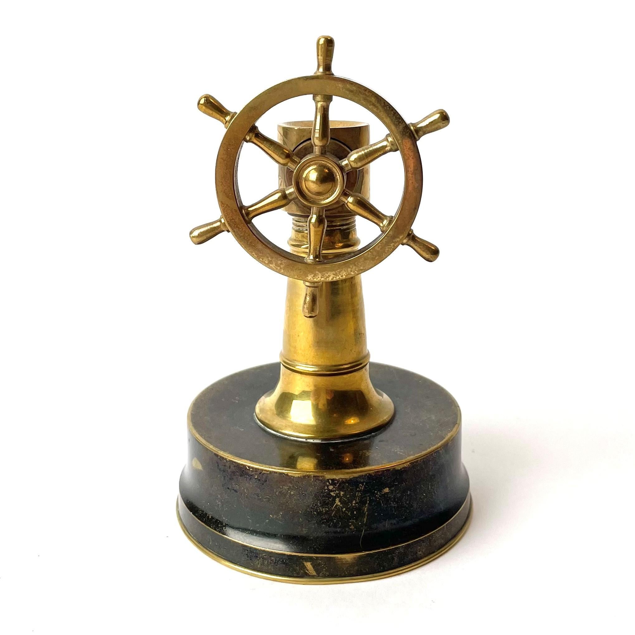 Rare cigar cutter in the shape of a ships wheel, Made in brass during the early 20th Century. Some patina but in good condition and works well.

Wear consistent with age and use.