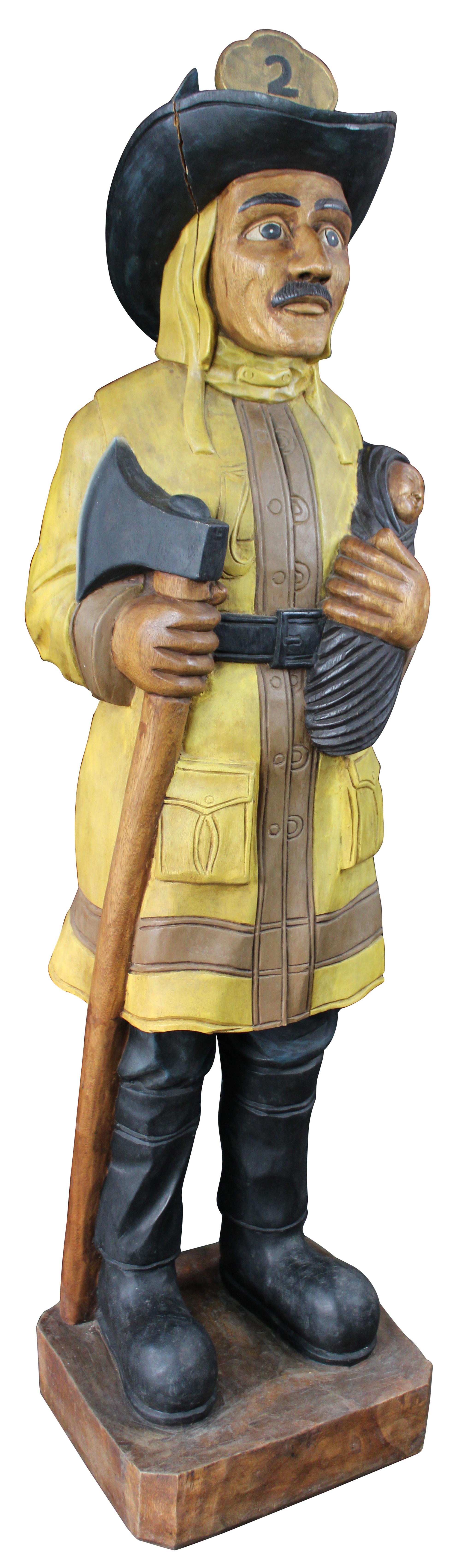 Vintage cigar store fireman or firefighter. Features a fireman in yellow with black boots and #2 hat holding an ax and baby. Carved from one piece of wood.
  