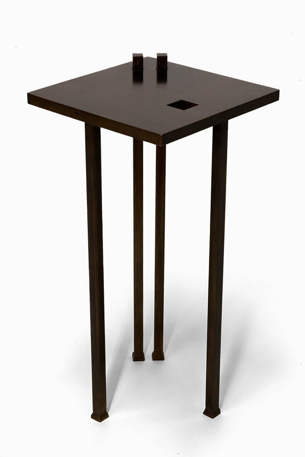 Cigar Table by Cal Summers
Dimension:  D 30.48 x H 60.96 cm
Materials: Sculpted Steel with Bronze Patina and Waxed finish.

Cal Summers is a British designer who makes bespoke handmade furniture and contemporary artefacts in which he challenges the