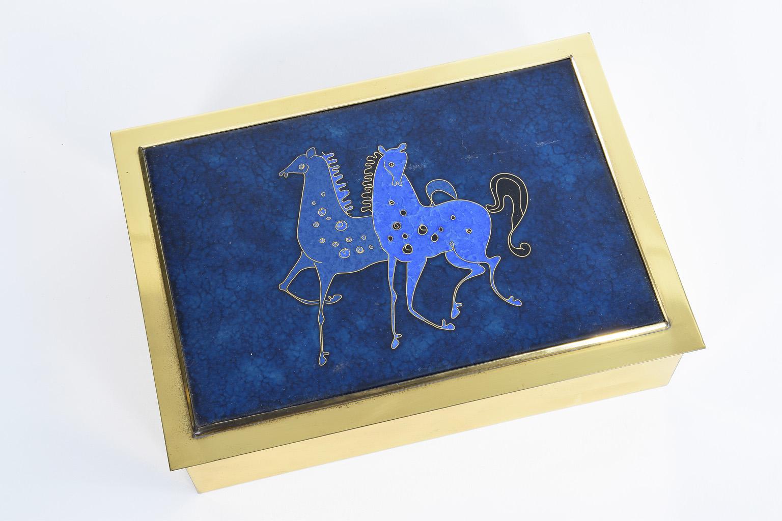 Rare cigarette brass box with an enameled lid with an Inlay of a pair of horses, 1960s, Italy
comes with a wooden inlay.
 