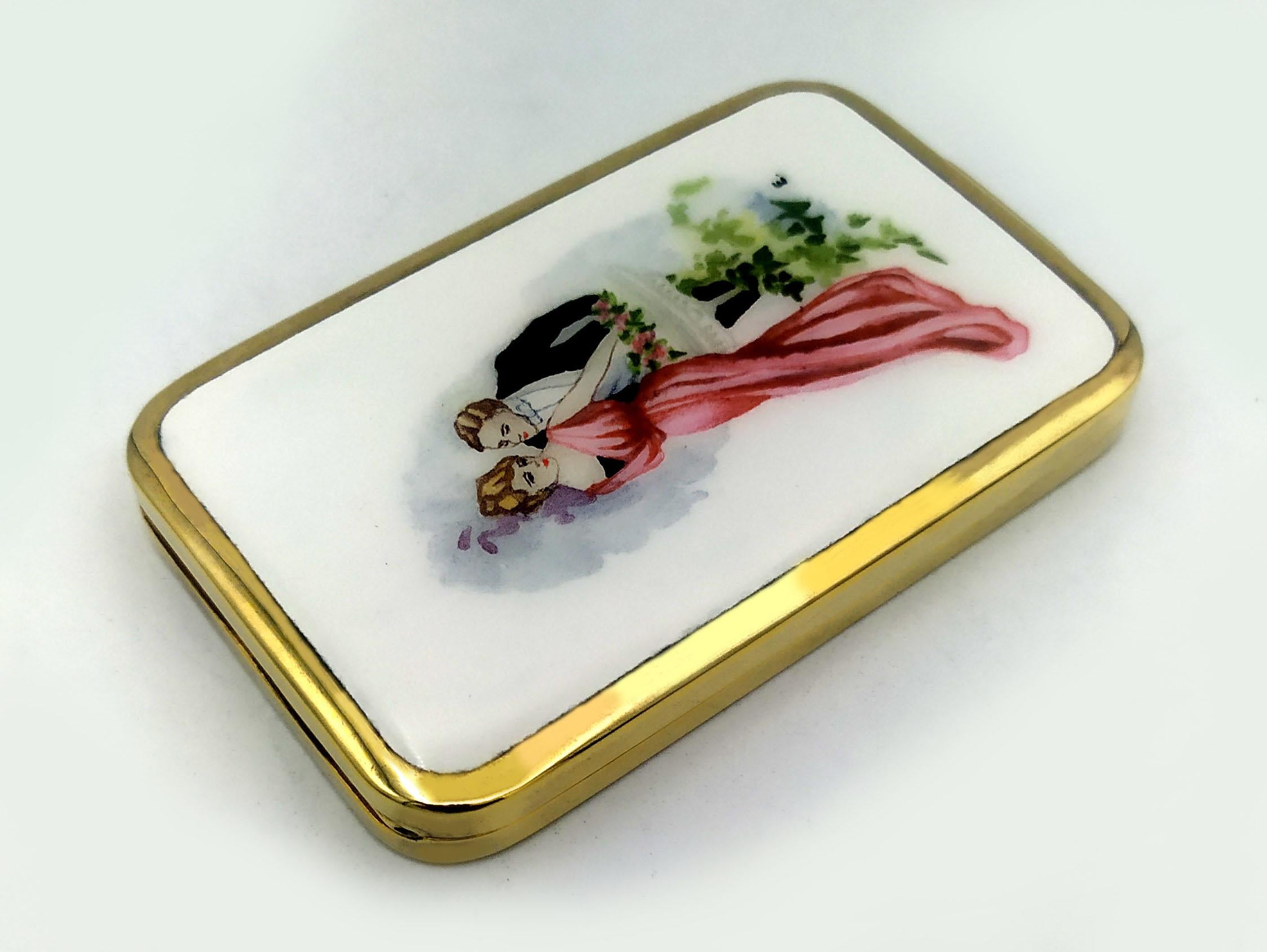 Rectangular desk cigarette case with rounded corners in sterling silver 925/1000 gold plated with fine hand-painted fire-enameled miniature depicting a romantic couple in Art Nouveau style. Dimensions cm. 5.7 x 9.2 x 1.2. Weight gr. 130. Designed by
