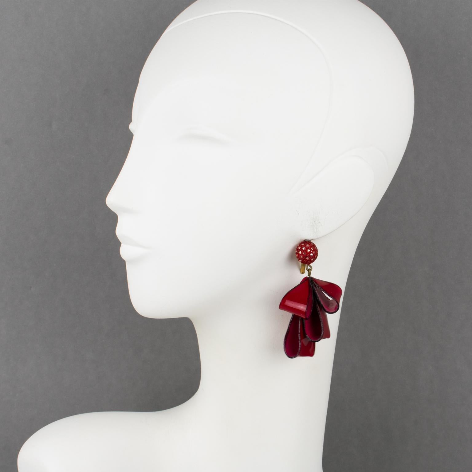 Adorable dimensional dangling pierced earrings by Cilea Paris. Hand-made artisanal resin earrings featuring dimensional ribbons with textured patterns built together to form a powerful statement piece. Very nice vivid ruby red and silver colors.