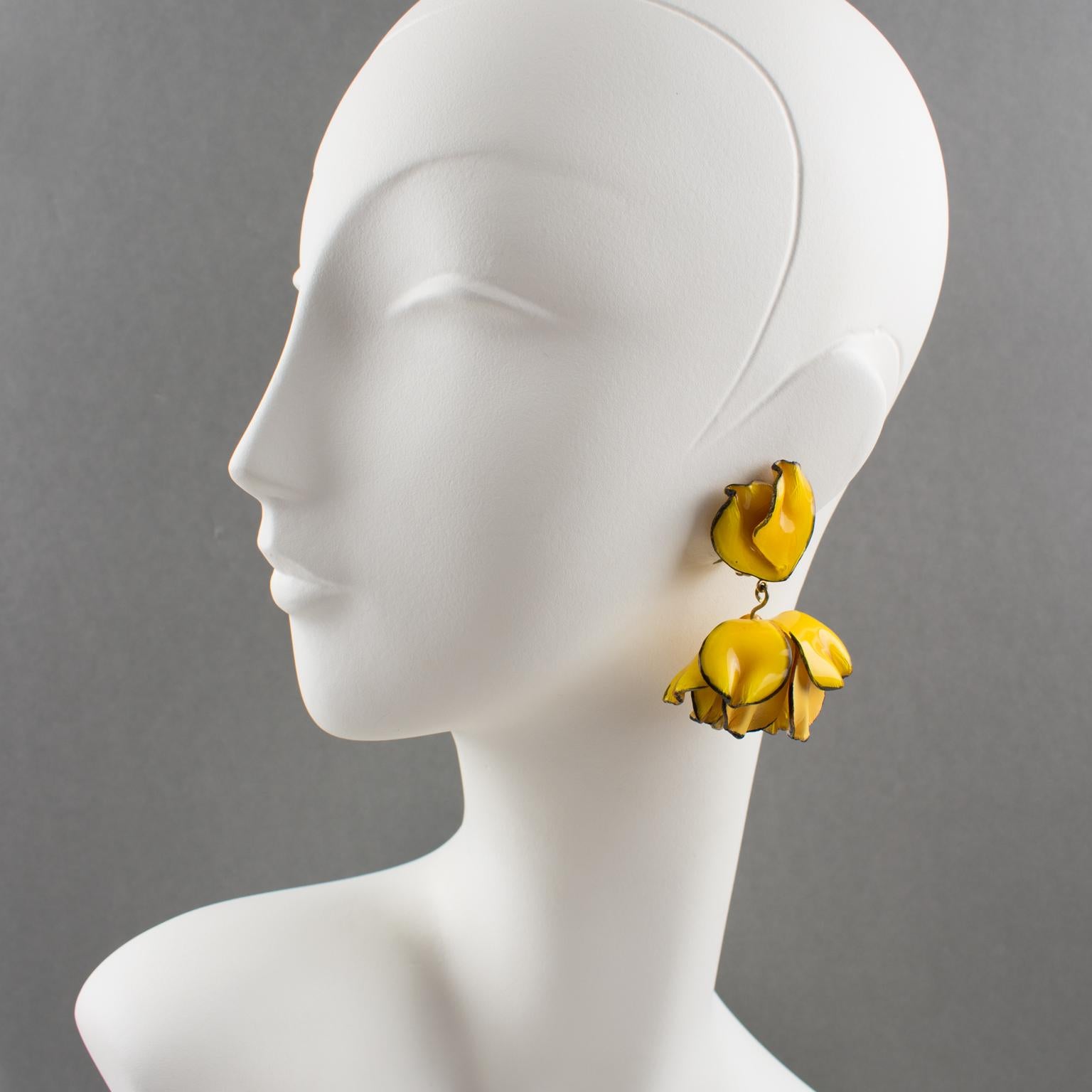Charming dimensional dangling clip-on earrings by Cilea Paris. Floral inspired hand-made artisanal resin or Talosel earrings featuring poppy flower with textured pattern build together to form a powerful statement piece. Very nice vivid yellow egg