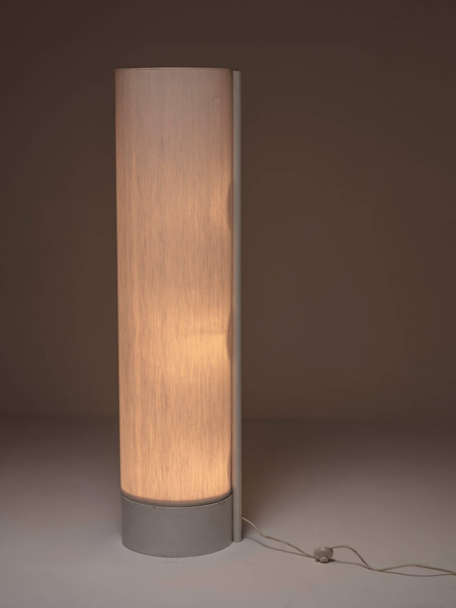 Minimal Cilindro floor lamp by Giuliana Gramigna for Quattrifolio.
A tall cylinder shade supported by a white enameled metal frame.
The lamp was reported for the selection of 