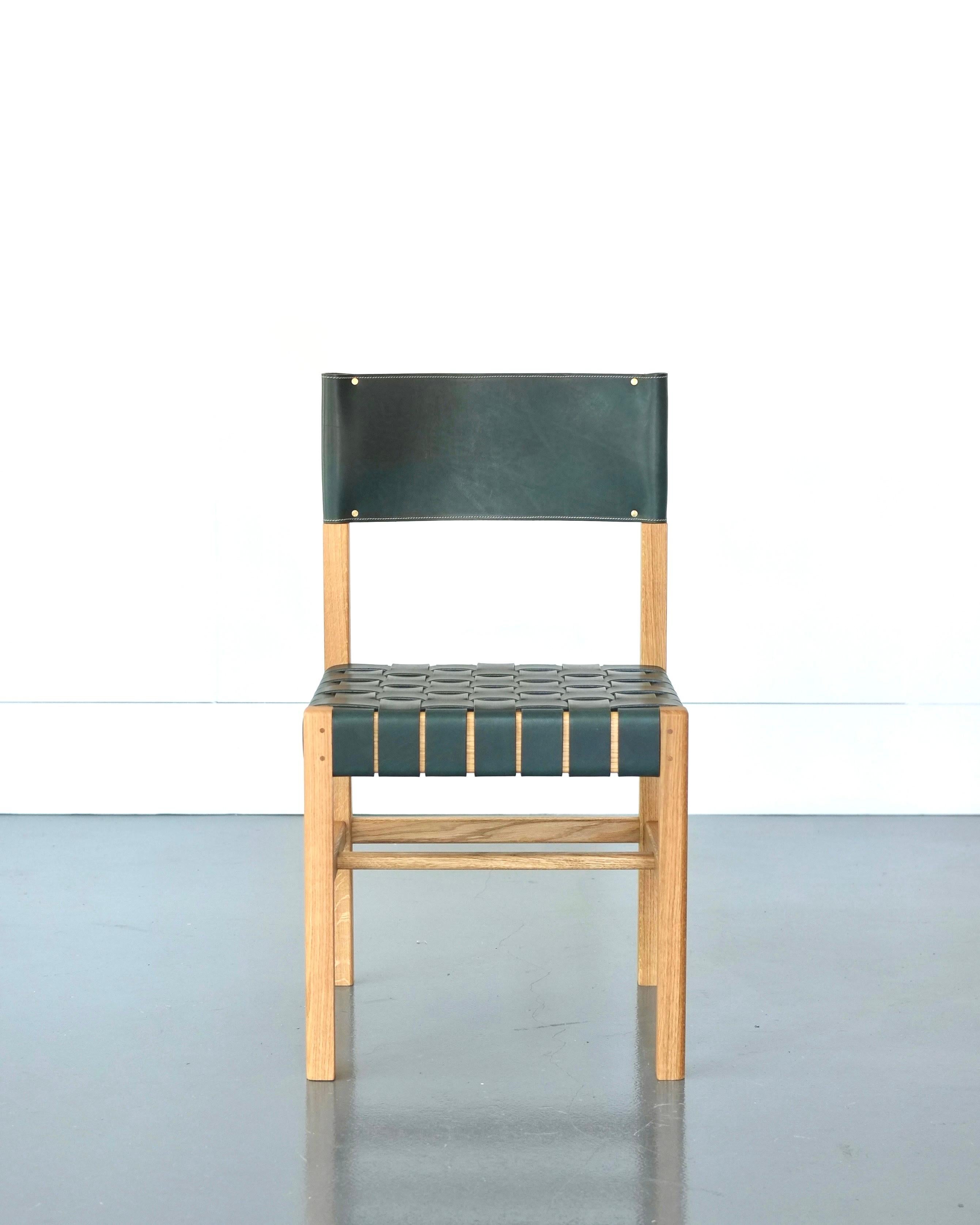 Inspired by the utilitarian and timeless minimalism of the Shaker tradition, the Cinch dining or occasional chair fuses traditional timber frame joinery and classic leather working techniques. Hand turned back legs and pinned tenon joints are paired