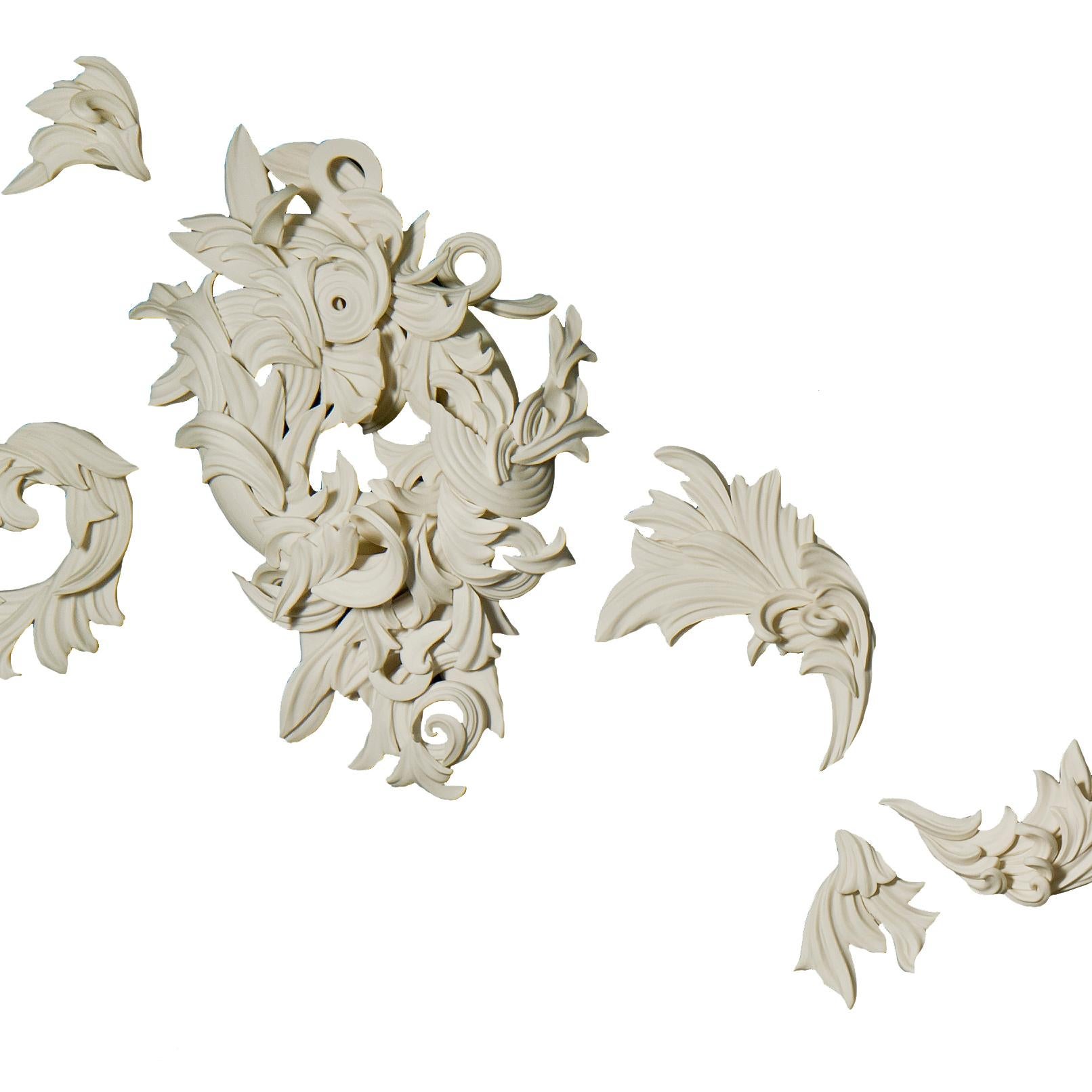 Cincture, is a unique handmade porcelain ceramic architectural wall installation by the British artist Jo Taylor. A completely hand-built artwork created from architectural-inspired flourishes and swirls consisting of 12 separate unique components.