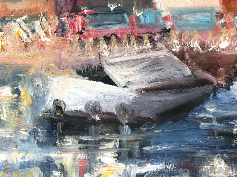 This painting depicts an impressionistic scene of Boats Docked in Portofino Italy, with beautiful brushwork and whimsical colors. The scene is captrued with a nostalgia, as the colors vibrate with emotion. 