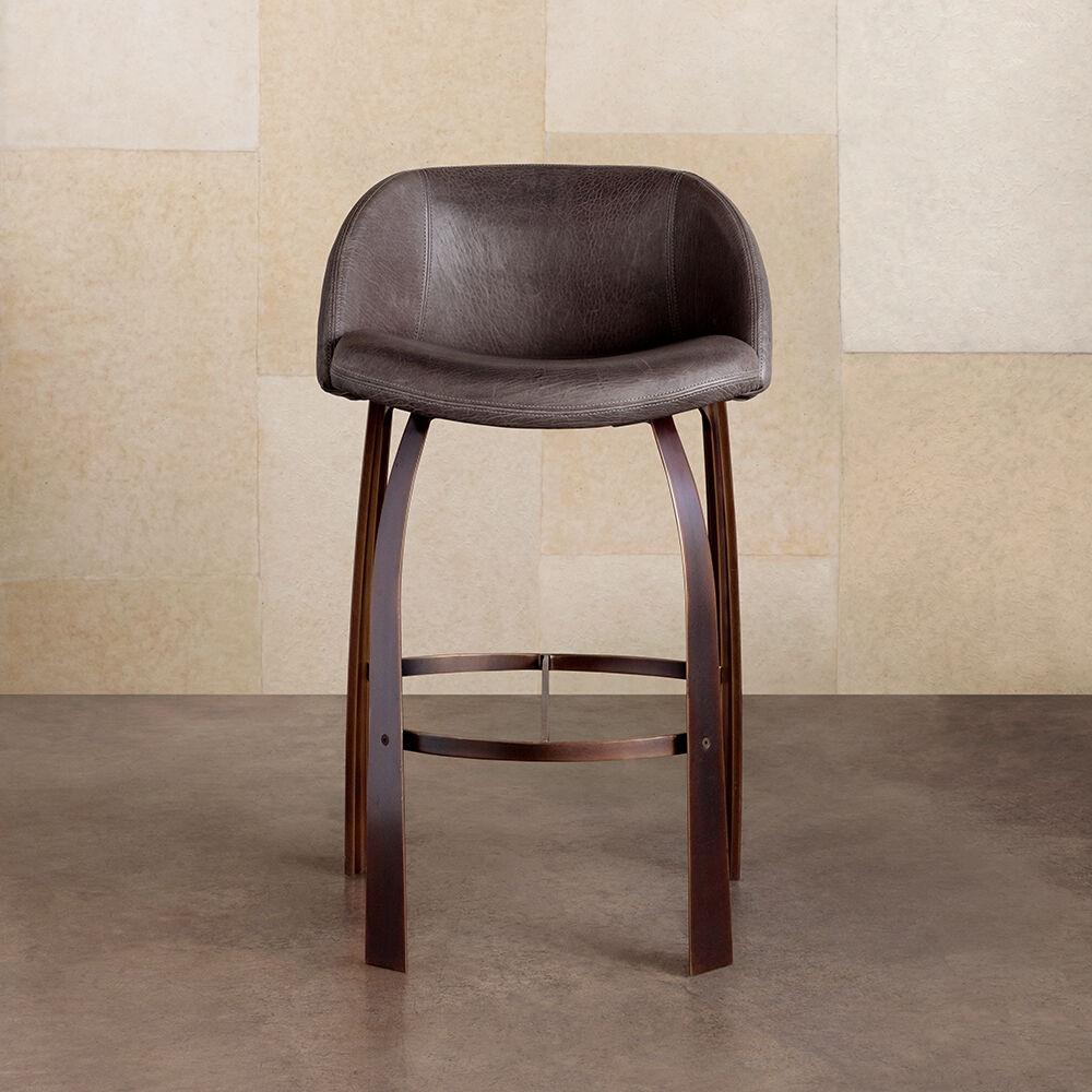 The Cine bar stool features subtly curving lines paired with a comfortably sweeping form. This stool features unique hand-milled aluminum legs in a burnished brass patina. The tightly upholstered leather seat and back has a fine stitching detail at