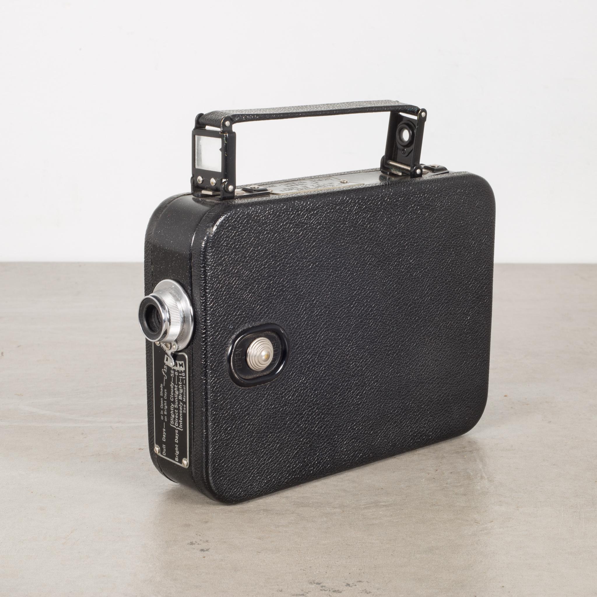 About:

This is a leather wrapped Cine-Kodak 8mm movie camera with a pop up viewfinder, leather handle and brass winding handle. Original leather case with handle and closing latch. This camera has retained its original finish. The camera may or