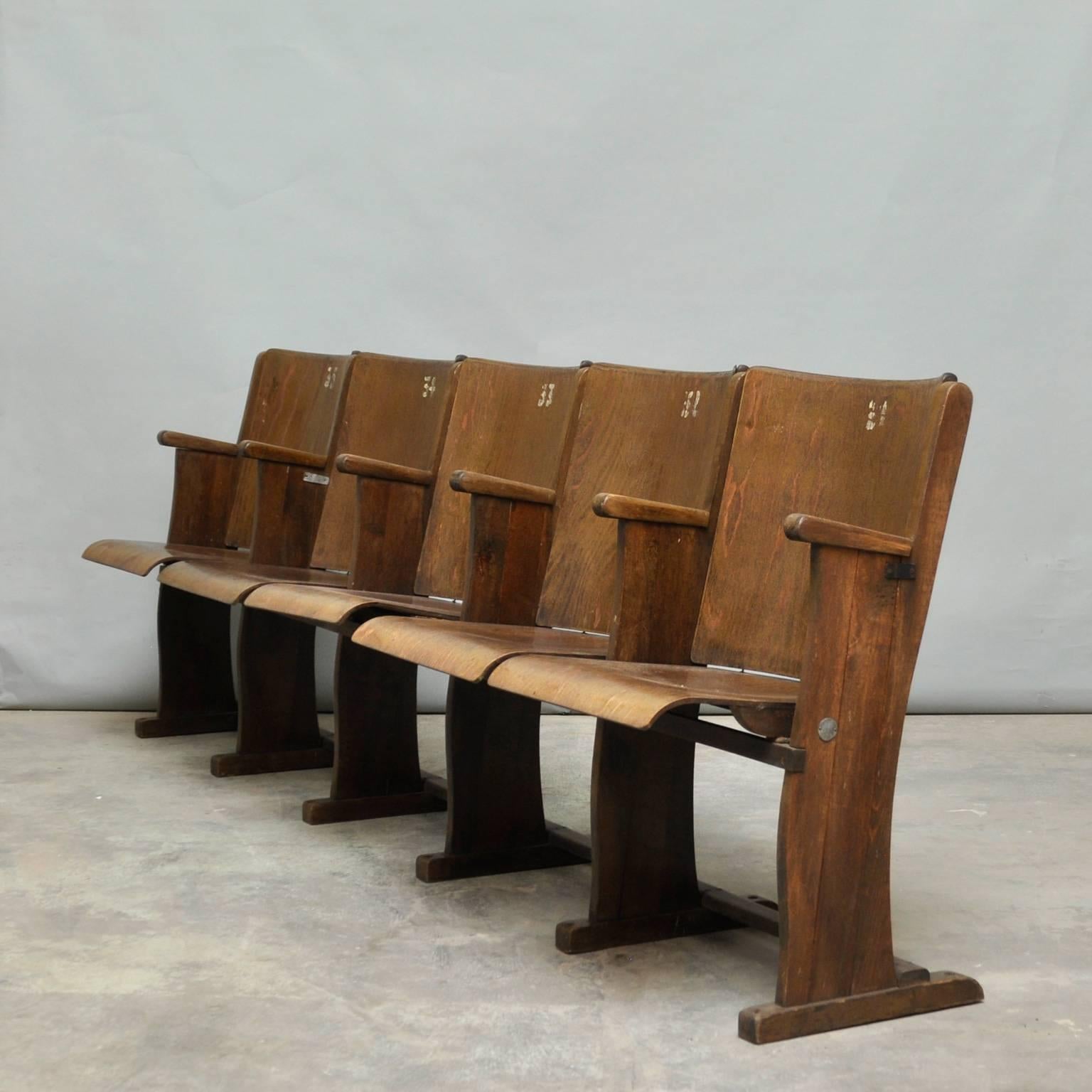 Row of five cinema seats. These chairs must be fixed to the floor. Produced by Thonet, circa 1950.