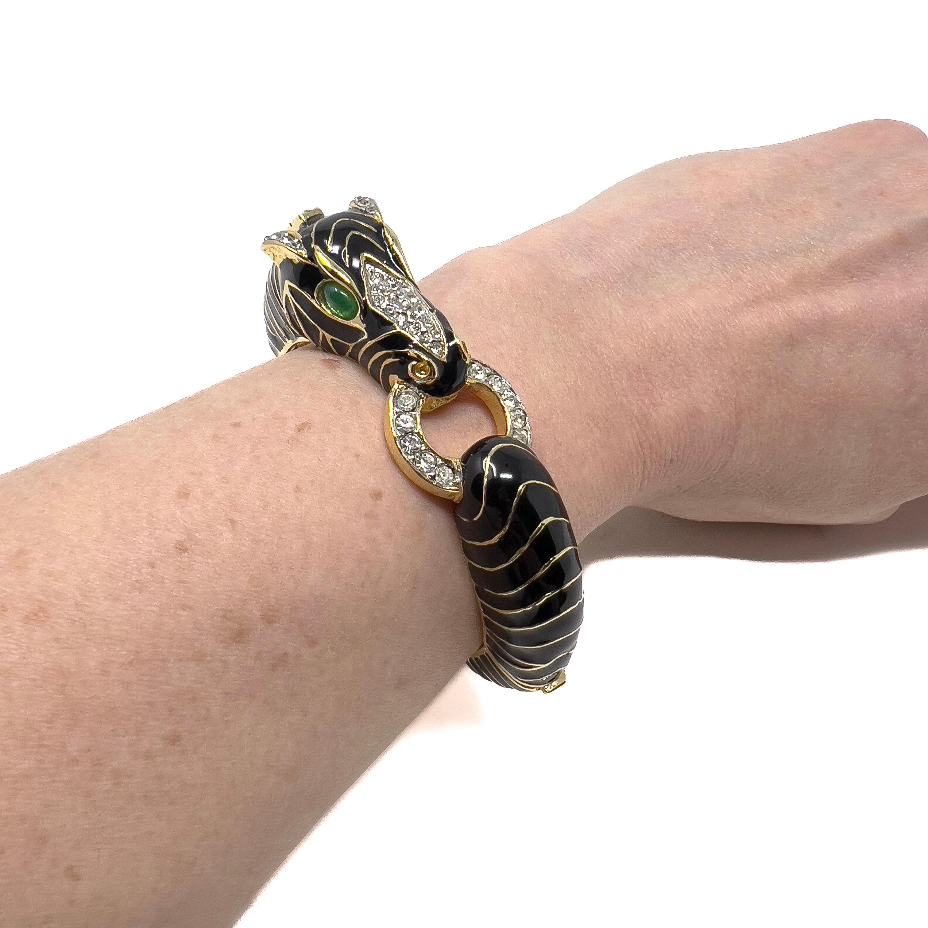 This stylish cuff was made in c.1970 by the American Ciner company. Their animal inspired designs are extremely collectable. 

Condition Report:
Excellent

The Details...
This gold plated, hinged cuff features a zebra design. It is detailed with