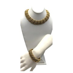 Ciner, 1980er–1990er Jahre: Halskette und Armband mit goldenem Kordelband und Strassakzenten