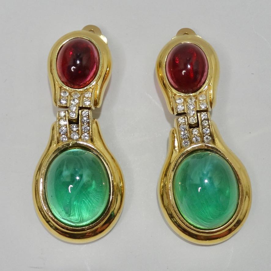 Eye catching 1980s gold plated Ciner earrings featuring the most gorgeous and vibrant red and green stones at the center! Classic drop style earring in the perfect size as to draw in the eye without making too big of a statement. Stunning yellow