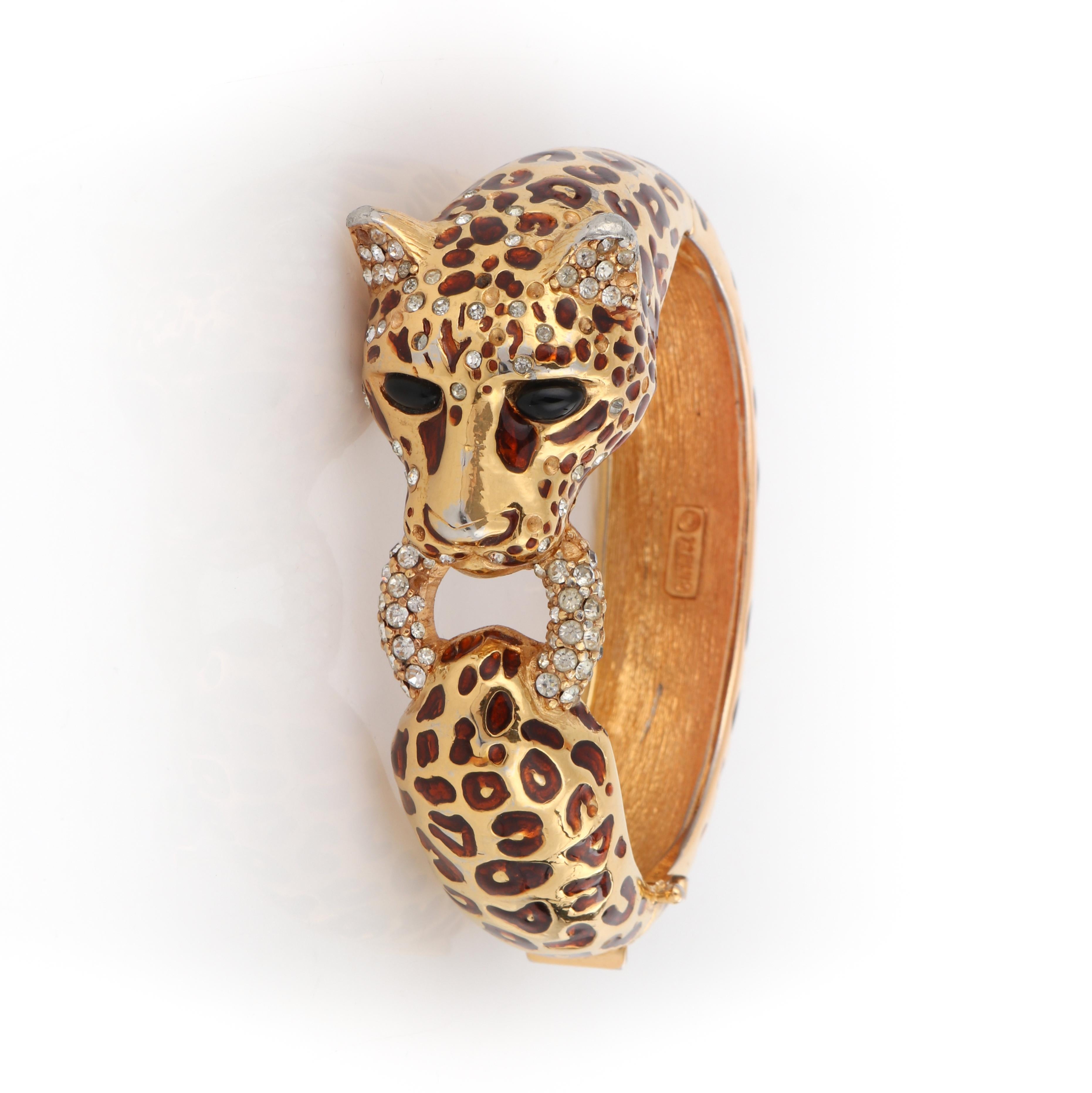 CINER c.1970s Gold Copper Enamel Swarovski Crystal Leopard Hinge Bangle Bracelet
 
Brand / Manufacturer: Ciner 
Circa: 1970s 
Style: Bangle bracelet 
Color(s): Shades of gold, copper, black
Unmarked Material (feel of): Body: Gold Plated Metal;
