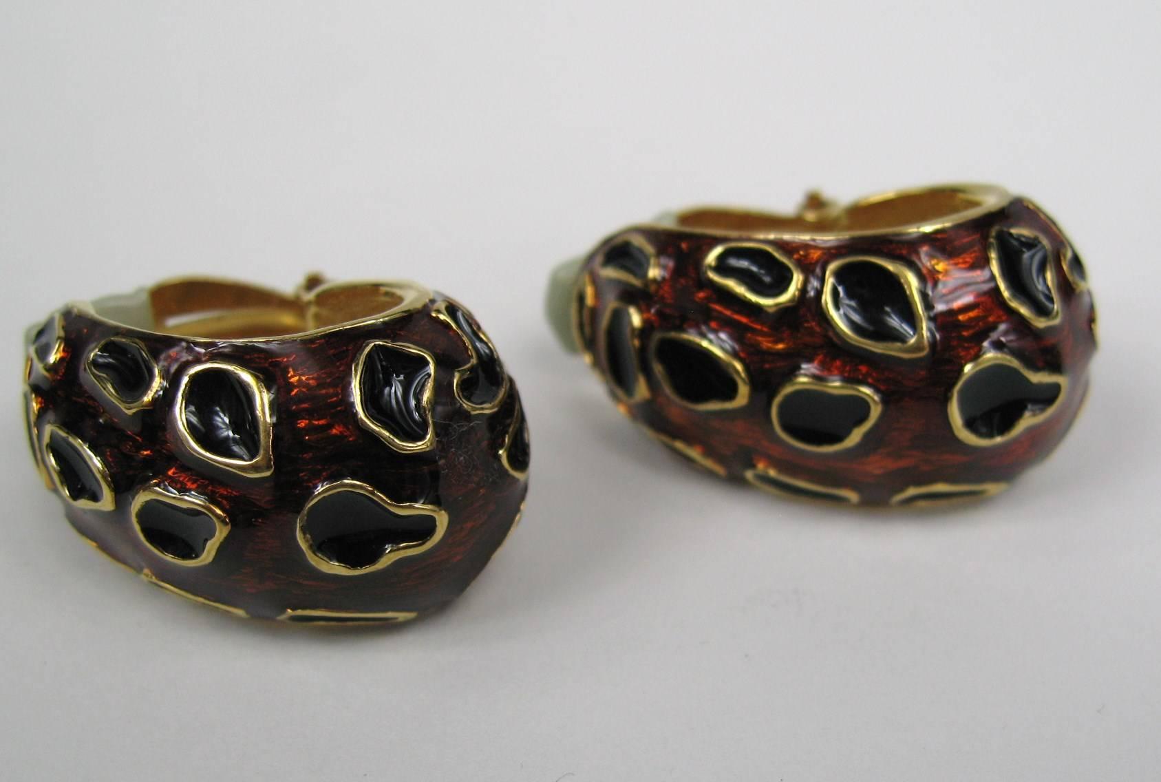 A Pair of enameled CINER earrings. These match the Giraffe Beaded Ciner necklace that is listed as well. They measure 1.48 top to bottom x .78  at the Widest Point. This is out of a massive collection of Contemporary designer clothing as well as