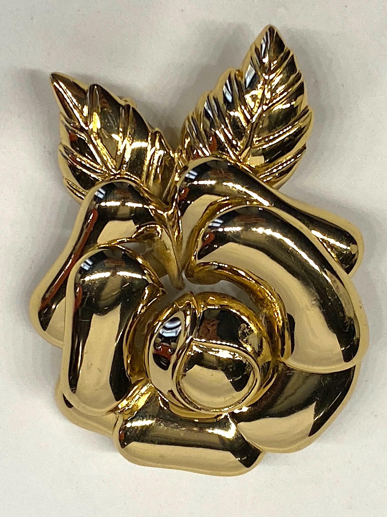 Lovely three dimensional gold plate rose brooch from New York fashion jewelry company Ciner. The brooch was meticulously cast in several pieces and hand soldered together and gold plated. All work is done in the NYC showroom and production center.