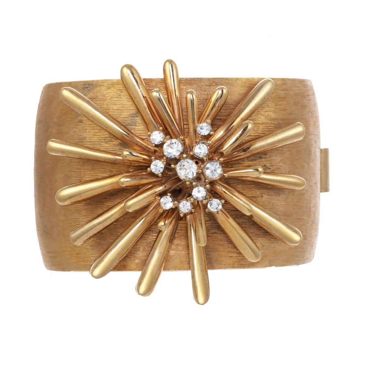 Bold and beautiful! We simply adore the sputnik features on this signature CINER cuff. Gorgeous crystal rhinestones add the perfect amount of sparkles to this textured gold cuff.

Materials 
Pewter
18K Gold Plating
Crystal Rhinestones
Box and Tongue