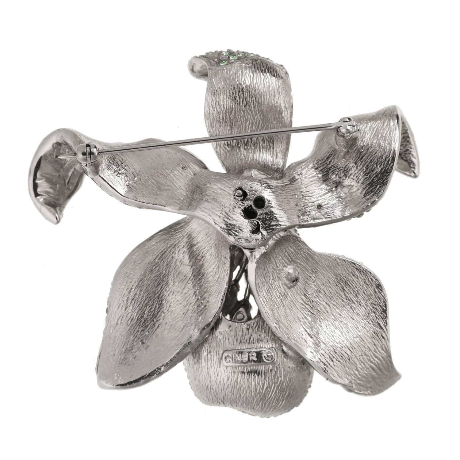 A classic CINER piece, this blooming orchid is the perfect accessory for any and every season! 

Materials:
Pewter
Rhodium Plating
Indian Sapphire Rhinestones
Light Azore Rhinestones
Erinite Rhinestones
Jonquil Rhinestones
Brass Pin and Catch