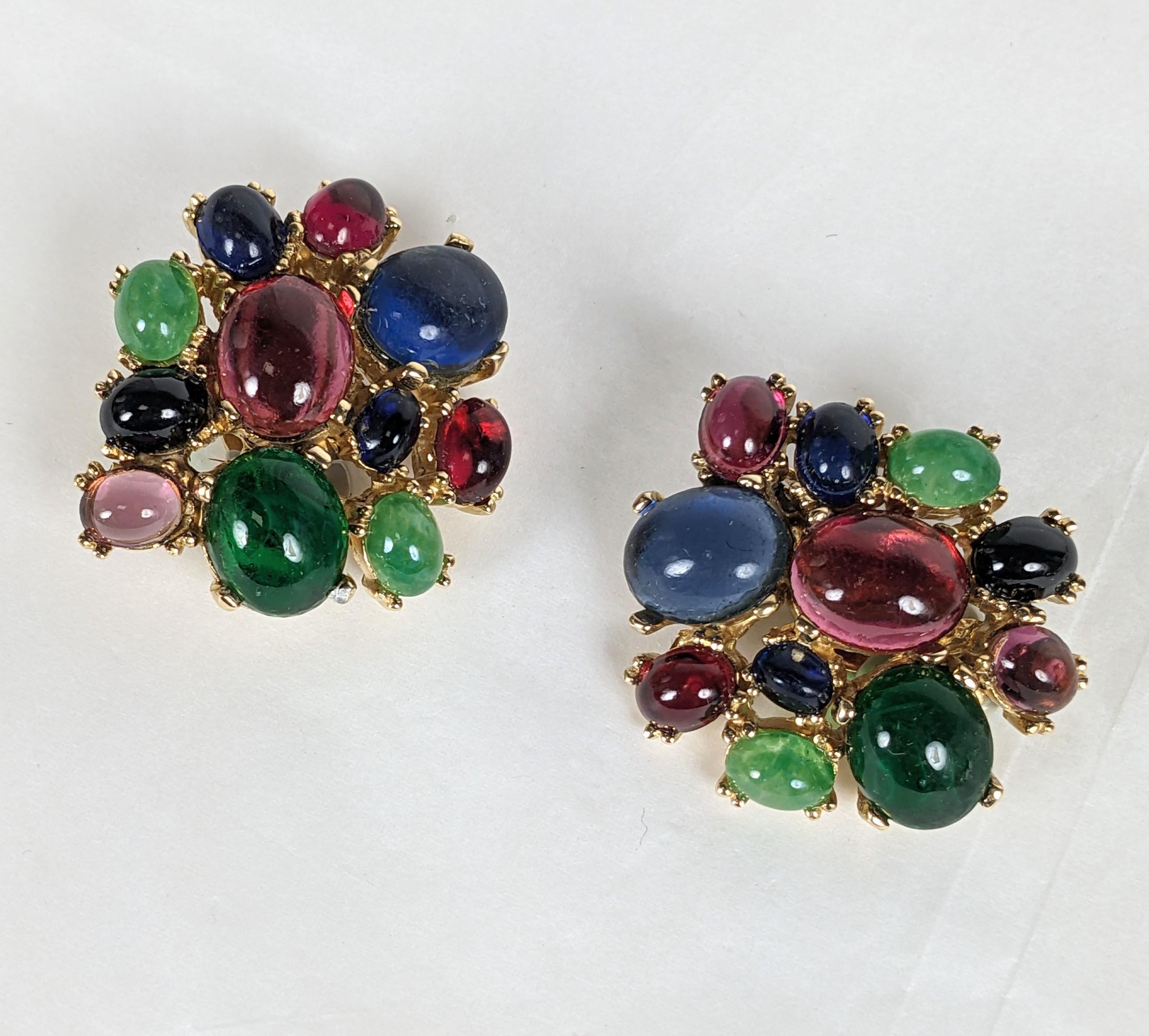 Striking and Elegant Ciner Multi Cabochon Ear Clips from the 1990's. Various colored paste cabochons are set into gilt metal settings with clip back fittings. 1.25