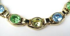 Collier Ciner en cristal swarovski vert, bleu et jaune, neuf  Jamais porté - années 1980