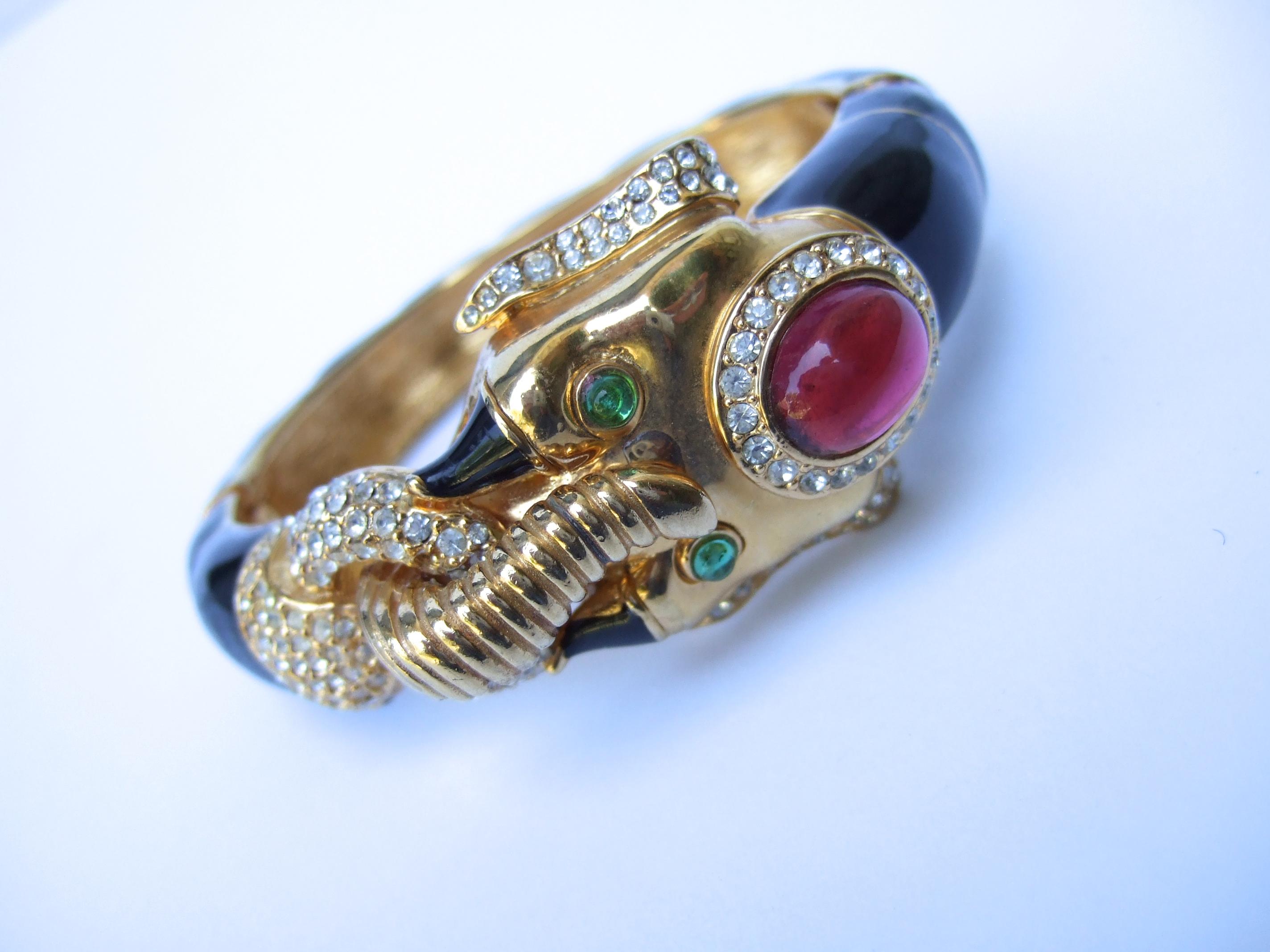 gold plated hinged signed gem encrusted Vintage ‘ CINER’ clamped bangle