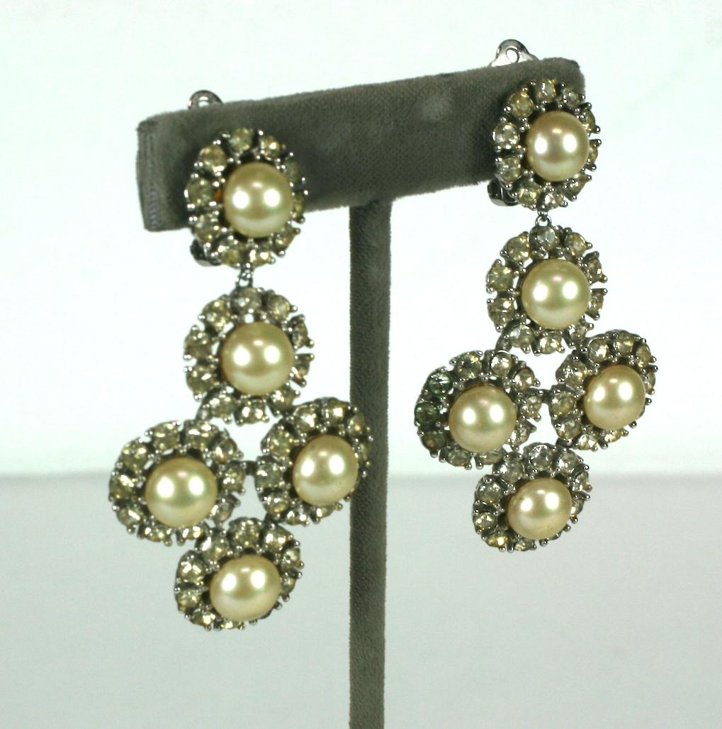 Ciner faux pearl and  crystal rhinestone pave pendant ear clips set in silvered metal.
Excellent Condition. 1960's USA. 
Length 2.50