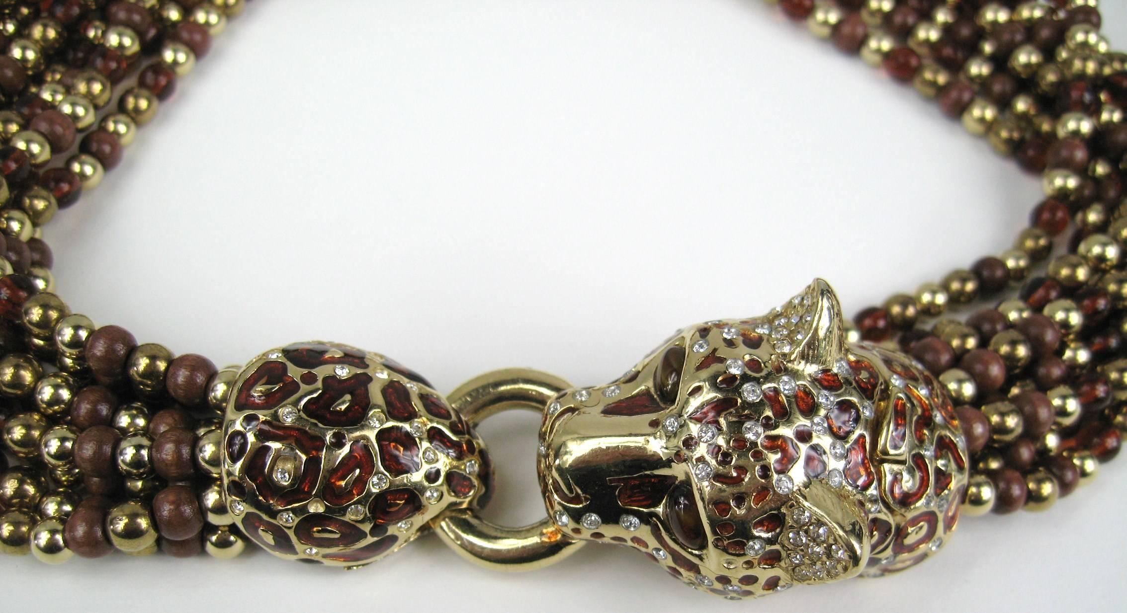 Ciner Kristall Kropfband Leopard  Halskette 9 Stränge aus goldfarbenen und braunen Perlen an der Halskette. Messen 17,75 Zoll lang Ende zu Ende. Die Schließe ist ein emaillierter Leopardenkopf. Passende Ohrringe sind ebenfalls in unserem Shop