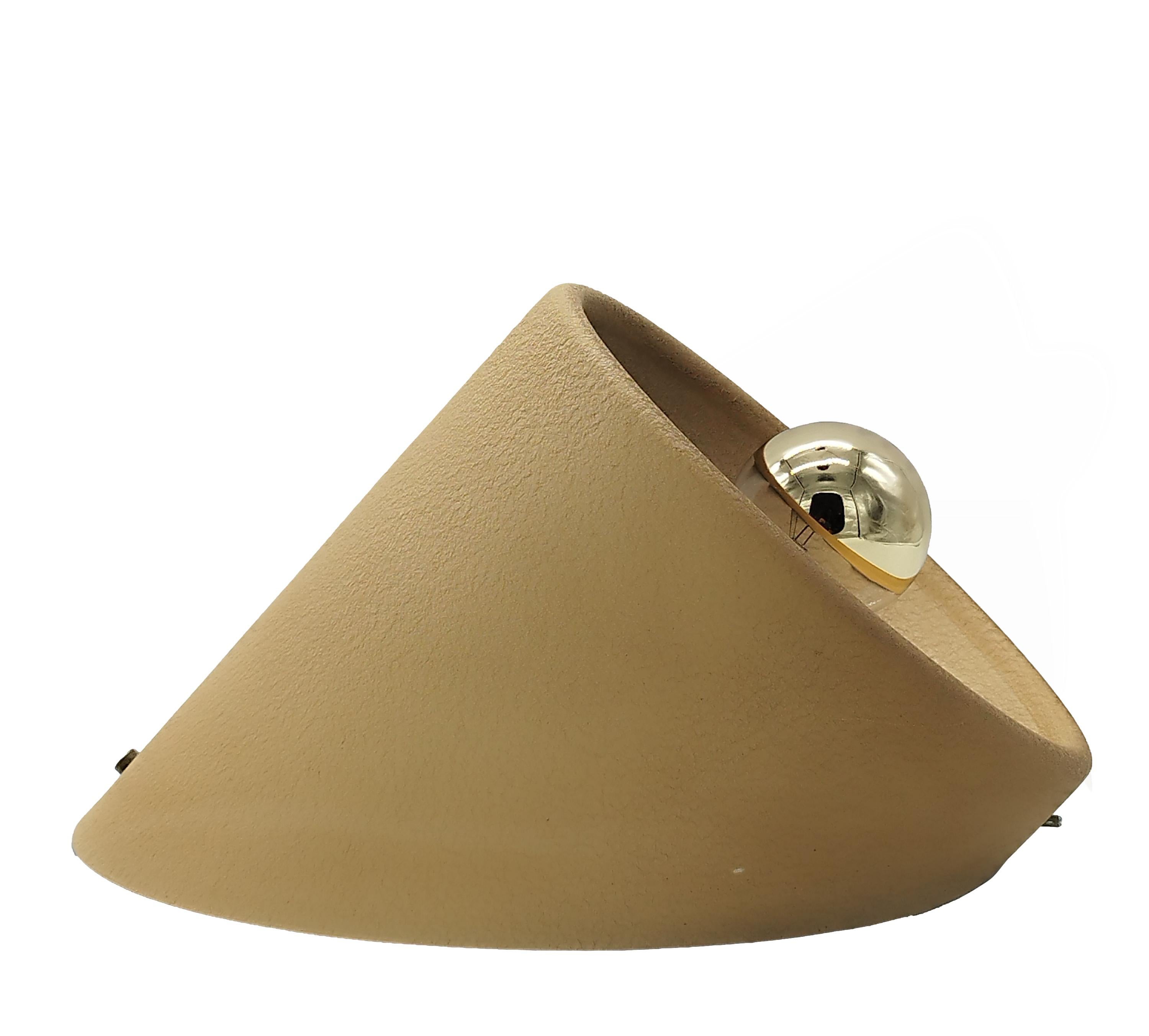 An ivory and cracquele' lacquered aluminium wall light, it can be mounted downwards or as an upward light.