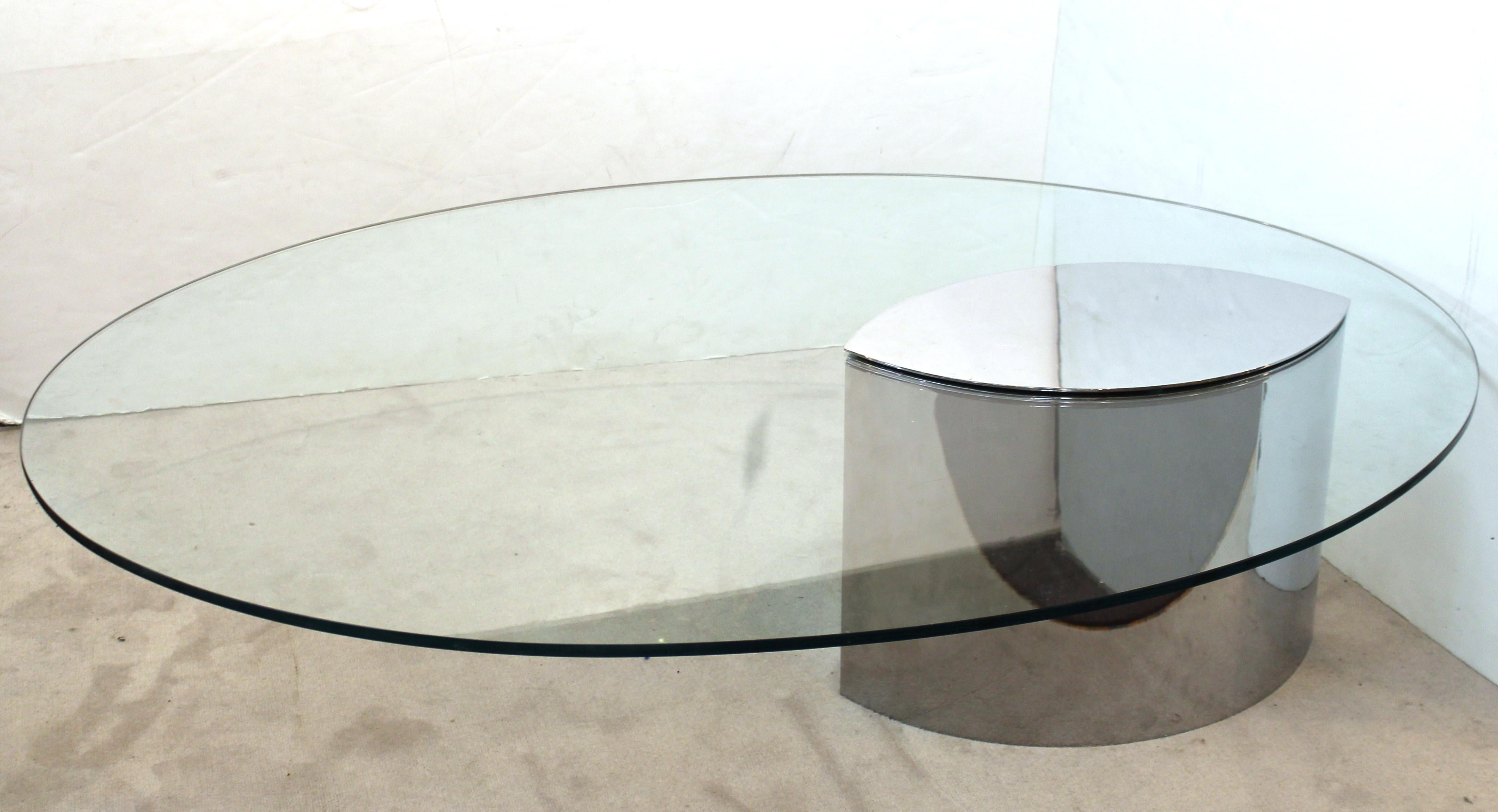 Cini Boeri for Knoll 'Lunario' cantilevered cocktail table with a thick oval glass plate and a base & cap in polished stainless steel. The piece was designed in the 1970s in Italy and is in great vintage condition.