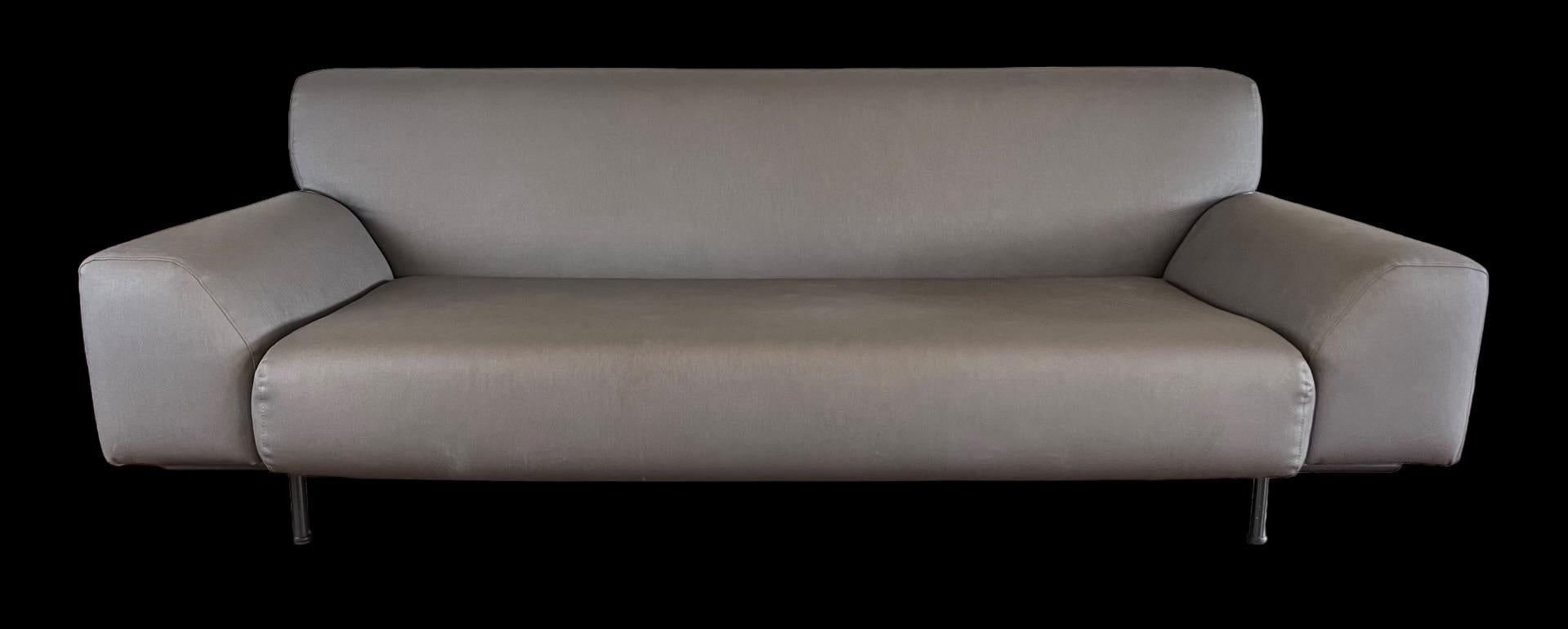 Handsome sofa from the Cini Boeri Collection for Knoll. Includes fixed locking castor option for back legs and three Cini Boeri Knoll throw pillows. This piece is clean and usable with no structural issues, but upholstery (charcoal gray vinyl (Knoll