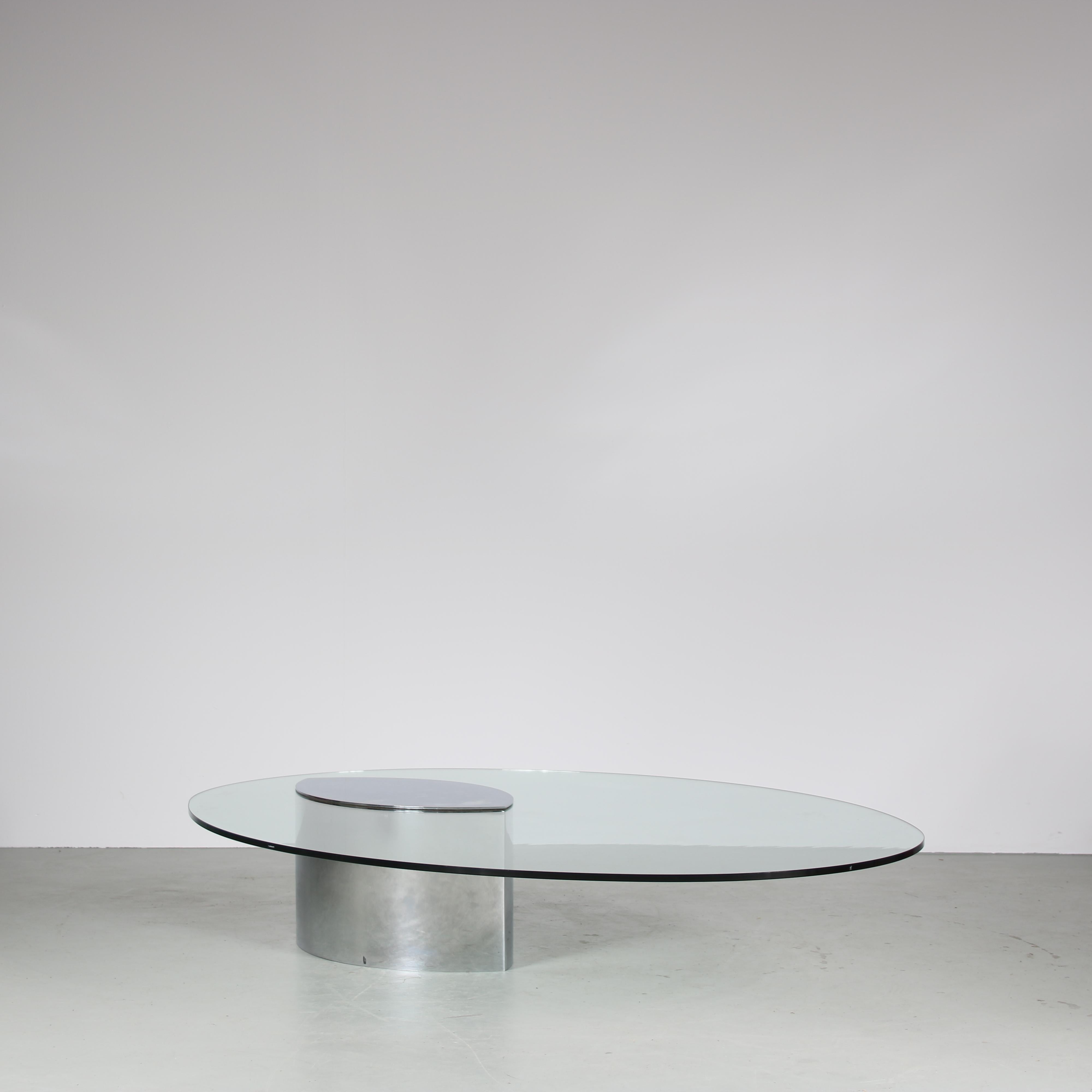 A beautiful coffee table, model “Lunario”, designed by Cini Boeri and manufactured by Gavina in Italy around 1970.

This outstanding piece has a stainless steel base with large, clear glass oval shaped top. This makes the piece a highly recognizable
