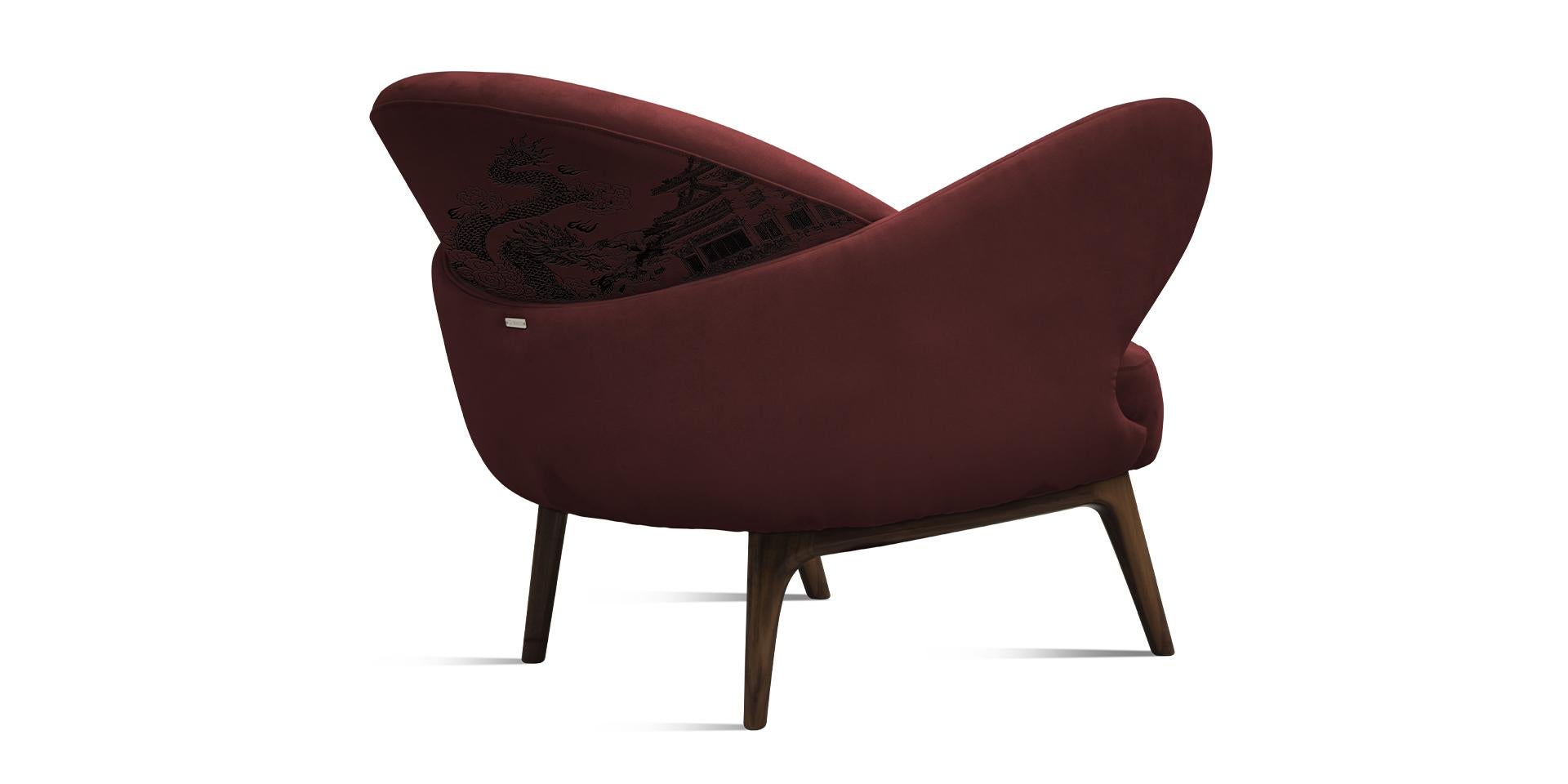 The Cinnabar armchair resorts to one of the most beautiful known technique: the embroidery. Highlighting the detailed pattern through line and dot details, until the walnut wood legs. Cinnabar armchair is a wonderful way to excite a desire for