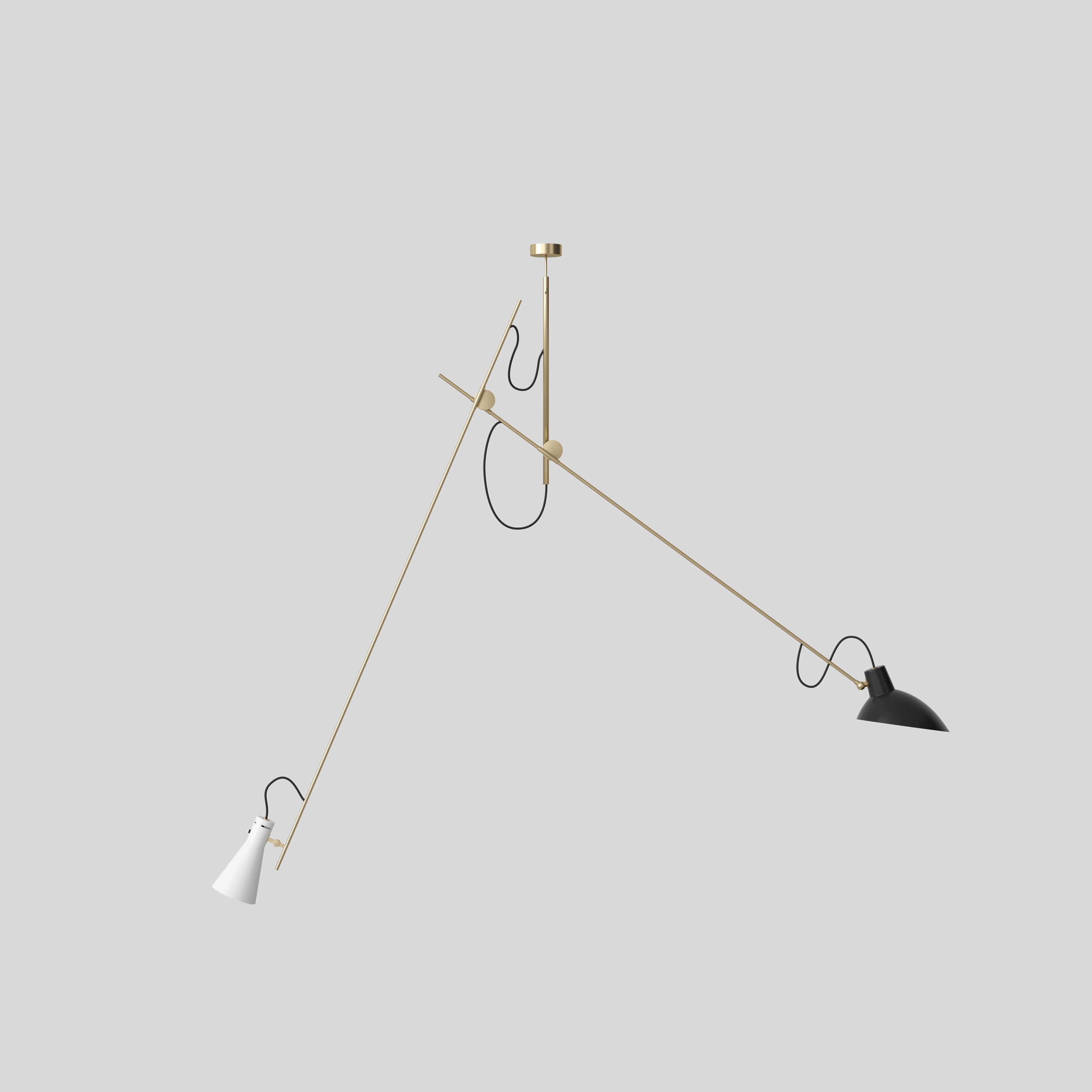 VV Cinquanta Suspension lamp
Design by Vittoriano Viganò
This version is with black and white lacquered reflector and brass frame.

The VV Cinquanta Suspension is elegant and versatile with two posable direct light sources.

With a distinctive