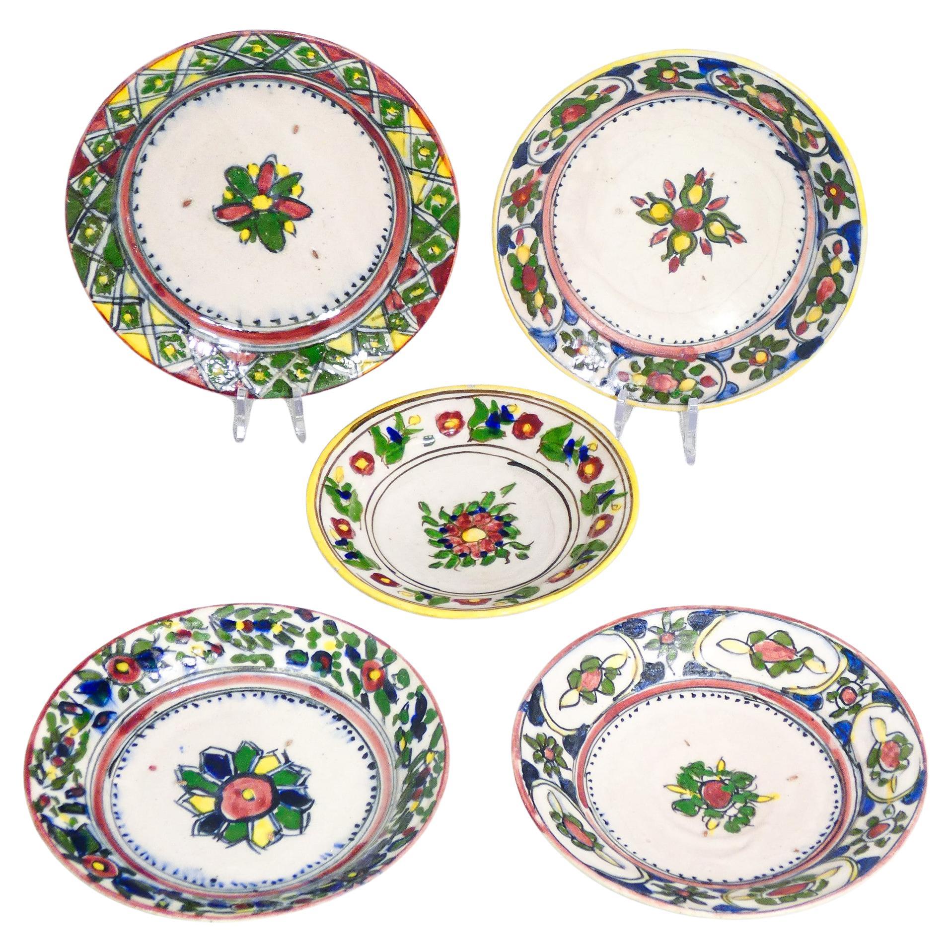 Five hand-painted and glazed majolica dishes. Central Italy. Nineteenth Century For Sale