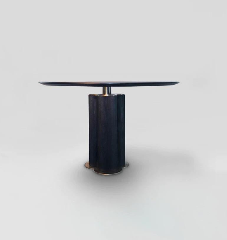 Cinta table by Atra Design
Dimensions: D 120 x H 75 cm
Materials: walnut wood, brass

Atra Design
We are Atra, a furniture brand produced by Atra form a mexico city–based high end production facility that also houses our founder Alexander Díaz