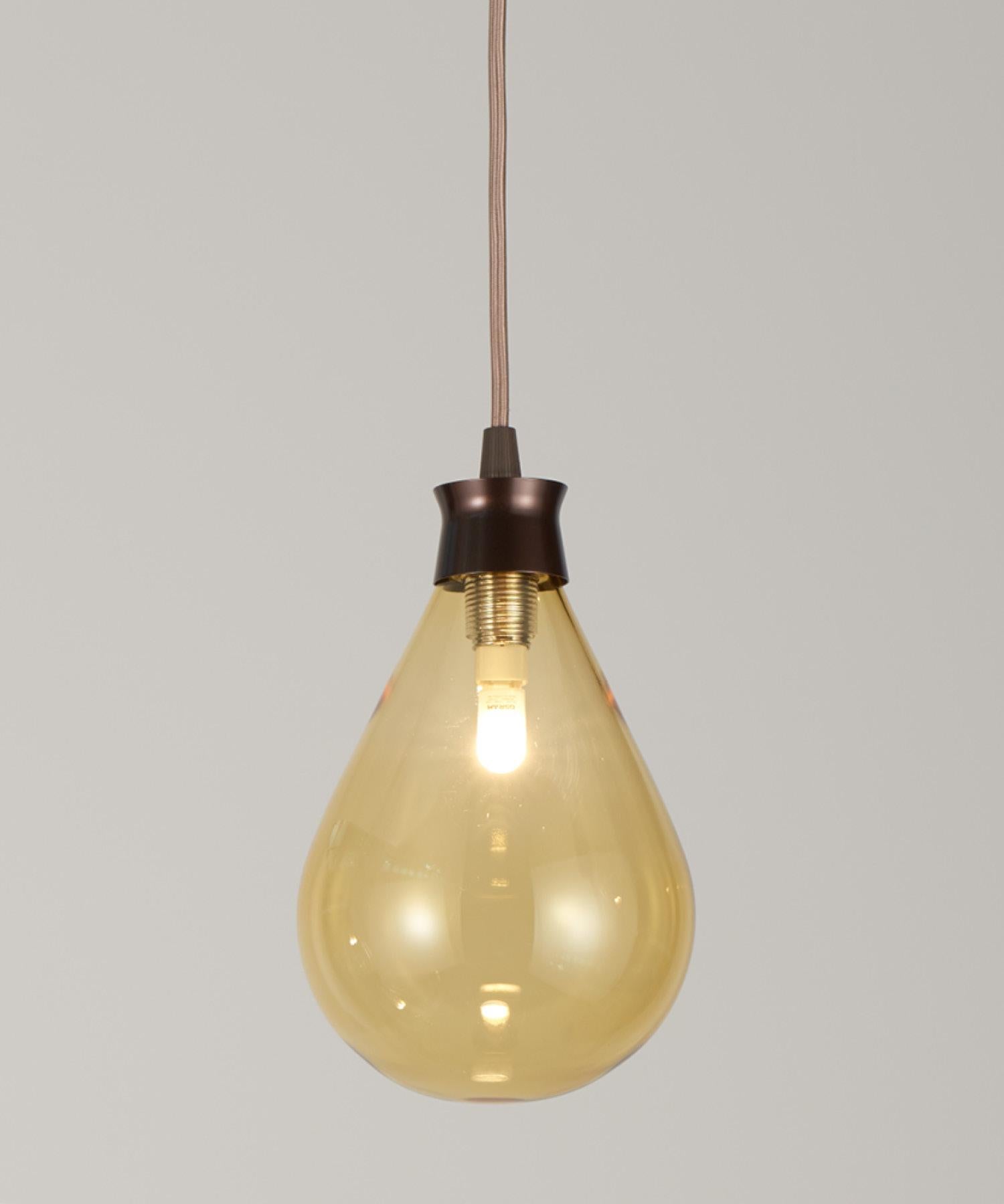 The Cintola Pendant works beautifully as a feature light for kitchens, bedrooms or living spaces. The handblown glass diffusers are available in a range of seven eye-catching colours, whilst the anodised-aluminium body keeps the overall aesthetic