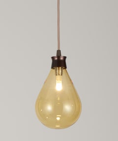 Cintola Pendant in Satin Bronze with Amber Glass by Tom Kirk