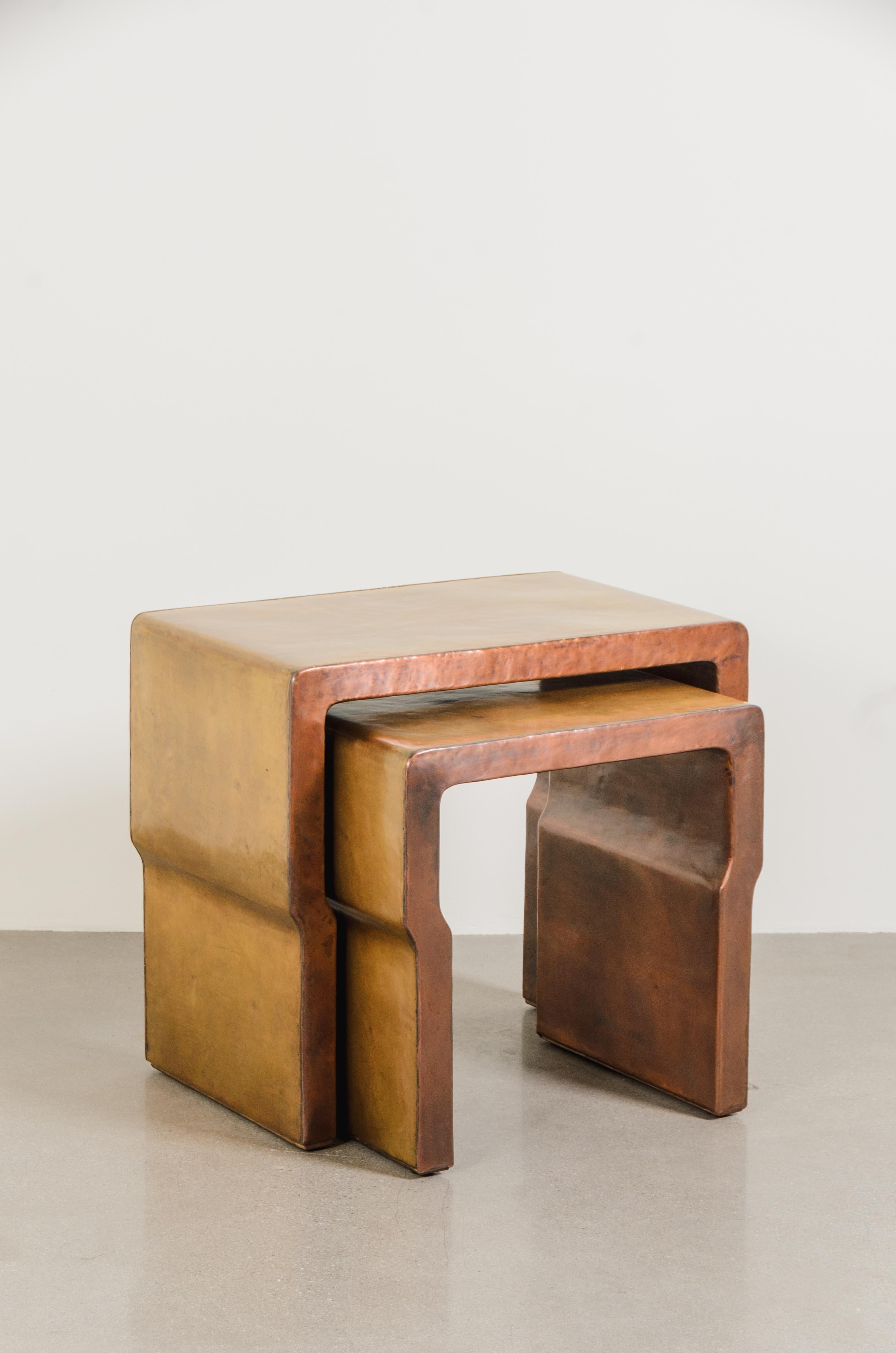 Cintura Nesting Tables with Copper (Set of 2)
Brass
Copper
Hand Repoussé
Limited Edition
Each piece is individually crafted and is unique. 

Repoussé is the traditional art of hand-hammering decorative relief onto sheet metal. The technique