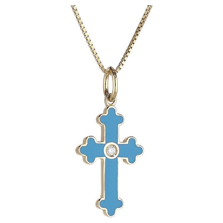 A delicate Latin-shaped cross pendant with a Byzantine-style design.
This cross is embellished with fire enamel work. This glazing technique ensures that the color remains bright and unchanged over time.
It therefore lends itself to being worn every