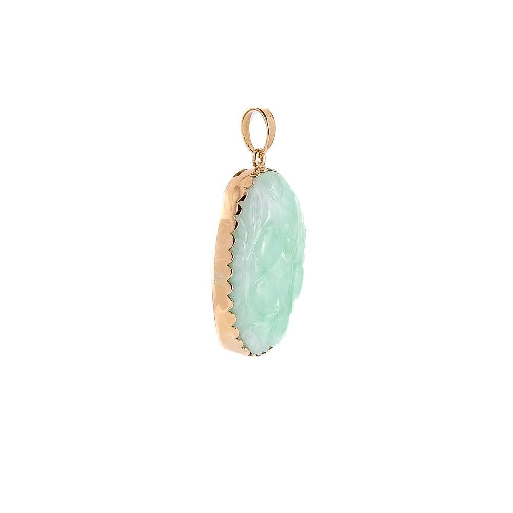 A rose gold pendant pendant with jade bas-relief can be described as a fine piece of jewelry that combines the warmth of rose gold with the natural elegance of jade. Rose gold, with its delicate pinkish hue, offers a harmonious contrast to the green
