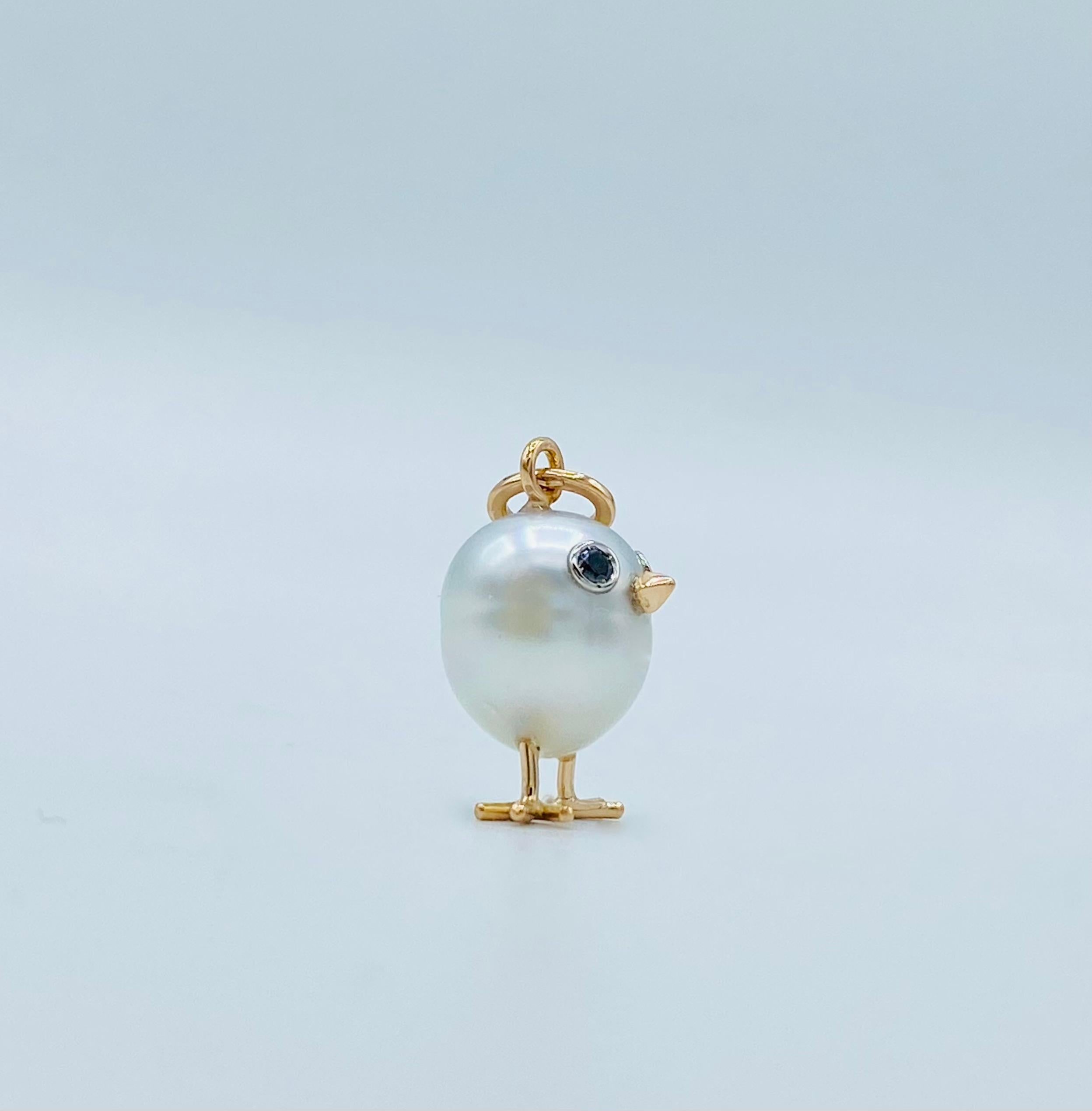 18Kt gold chick pendant with Australian pearl and black diamonds 1