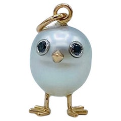 18Kt gold chick pendant with Australian pearl and black diamonds