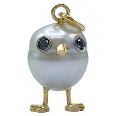 18Kt gold chick pendant with Australian pearl and black diamonds
