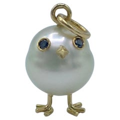 Ciondolo pulcino in oro 18Kt con perla Australiana e diamanti neri